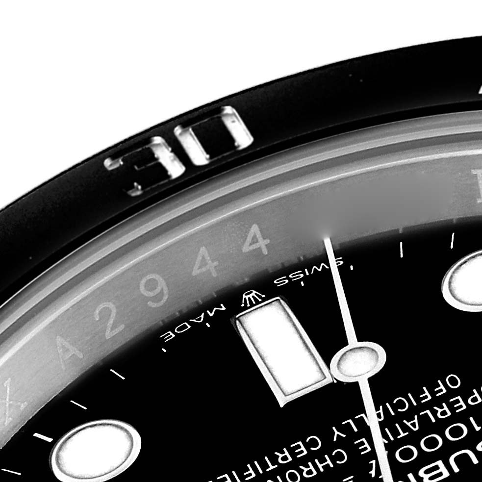 This close-up angle of the Rolex Submariner 124060 Men
s Stainless Steel Black Dial 124060 Men
s Stainless Steel Black Dial watch shows part of the bezel and dial, highlighting the "30" minute marker and some text.