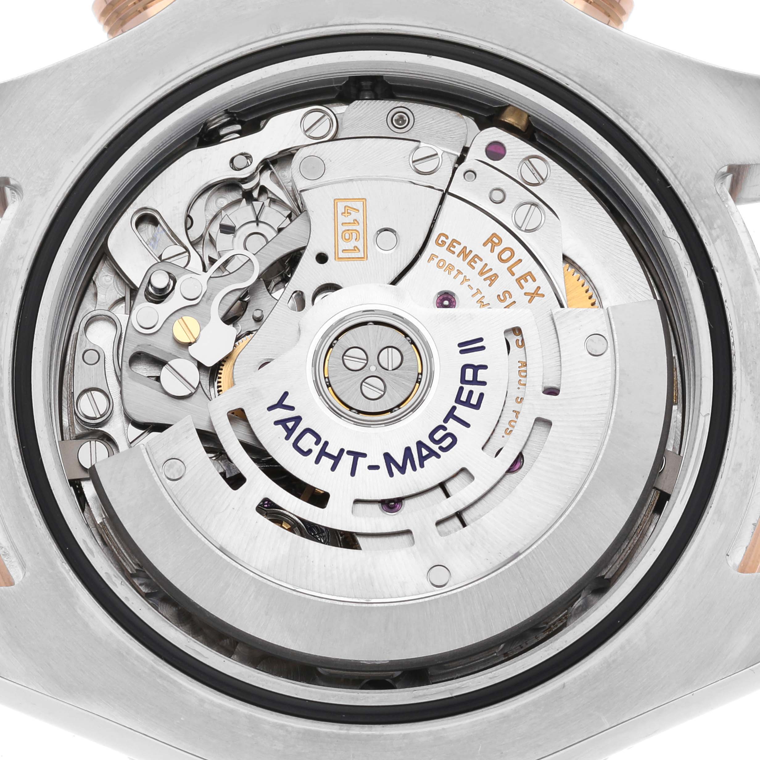 This image shows the intricate internal mechanism of a Rolex Yacht-Master 116681 Men's Steel and Gold (two tone) White Dial 116681 Men's Steel and Gold (two tone) White Dial II watch, viewed from the back case.
