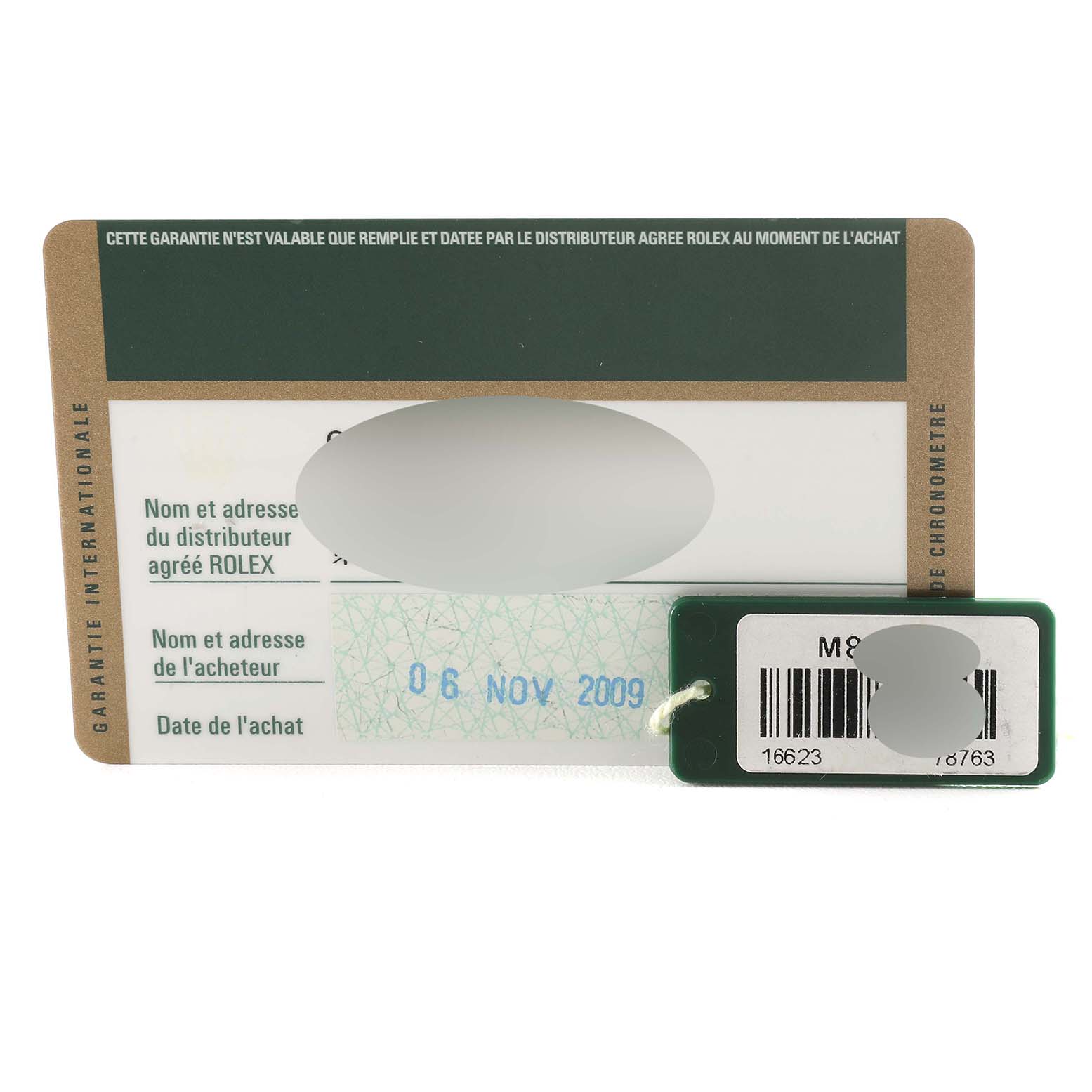 This image shows the warranty card and tag for a Rolex Yacht-Master 16623 Men's Steel and Gold (two tone) Mother of Pearl Dial 16623 Men's Steel and Gold (two tone) Mother of Pearl Dial watch, including the purchase date and barcode.