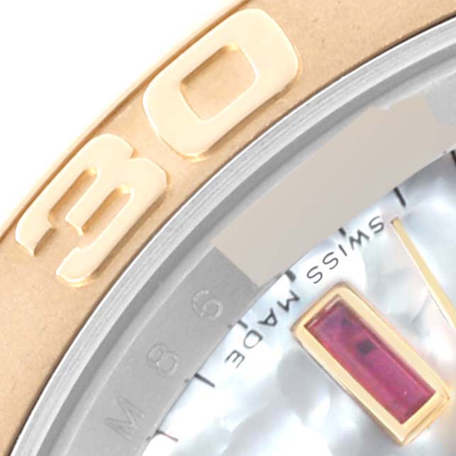 This close-up image features the bezel and part of the dial of the Rolex Yacht-Master 16623 Men's Steel and Gold (two tone) Mother of Pearl Dial 16623 Men's Steel and Gold (two tone) Mother of Pearl Dial watch.