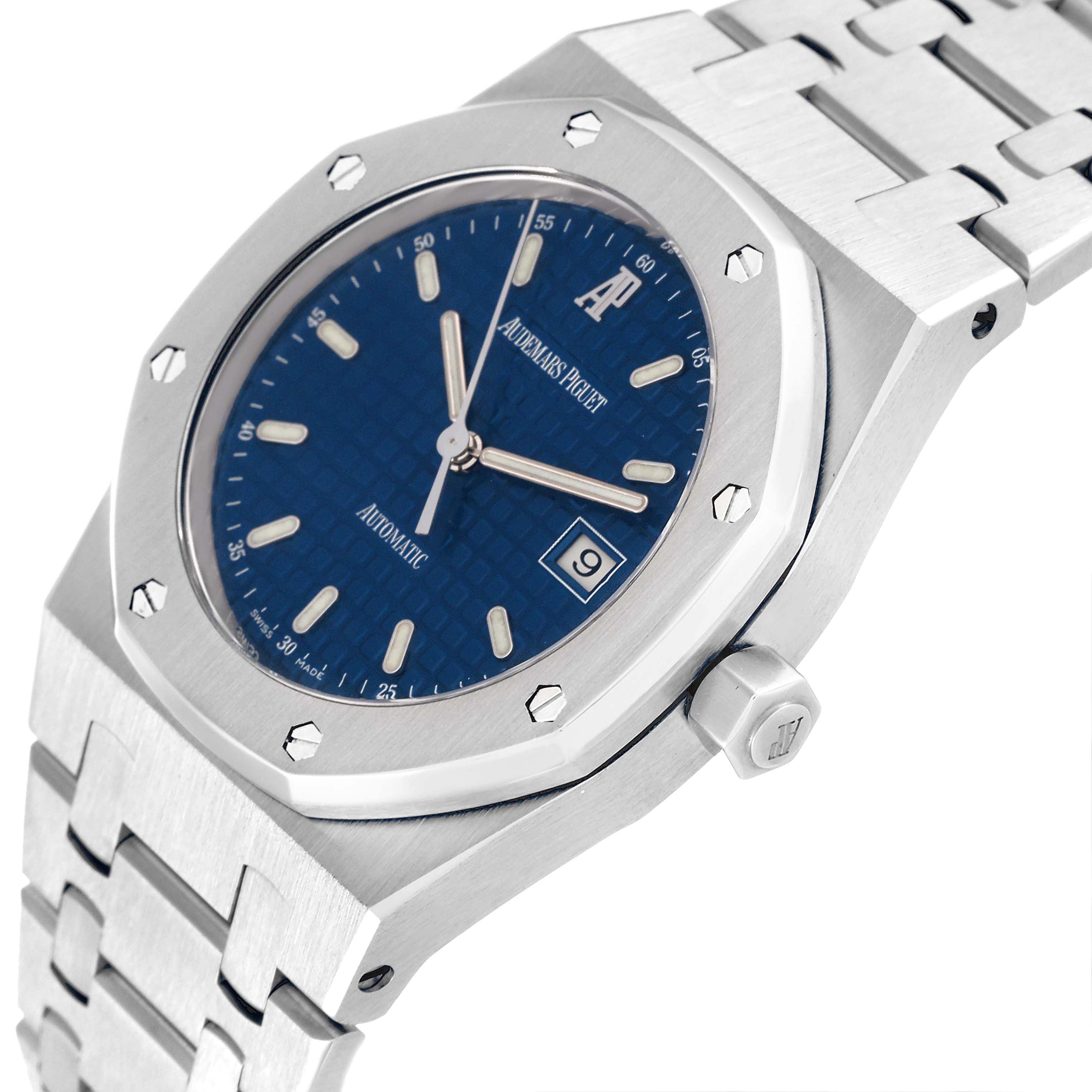 The image shows a close-up angle of the Audemars Piguet Royal Oak 15000ST.OO.0789ST.05 Men's Stainless Steel Blue Dial 15000ST.OO.0789ST.05 Men's Stainless Steel Blue Dial watch, highlighting its dial, bezel, crown, and bracelet.