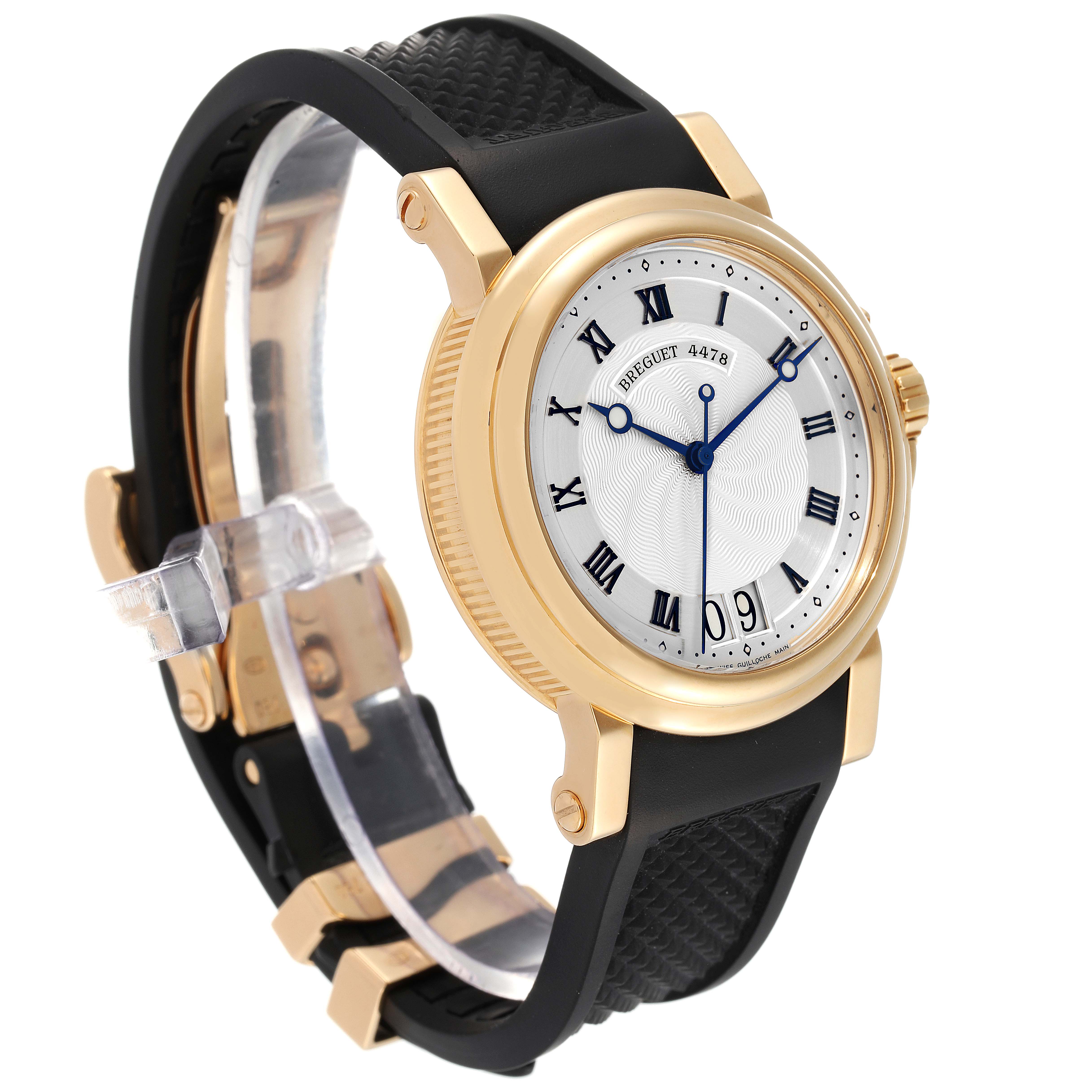 The image shows a Breguet Marine 5817BA/12/9V8 Men's Yellow Gold Silver Dial 5817BA/12/9V8 Men's Yellow Gold Silver Dial model watch at a three-quarter angle, highlighting its gold case, black strap, and dial with Roman numerals.