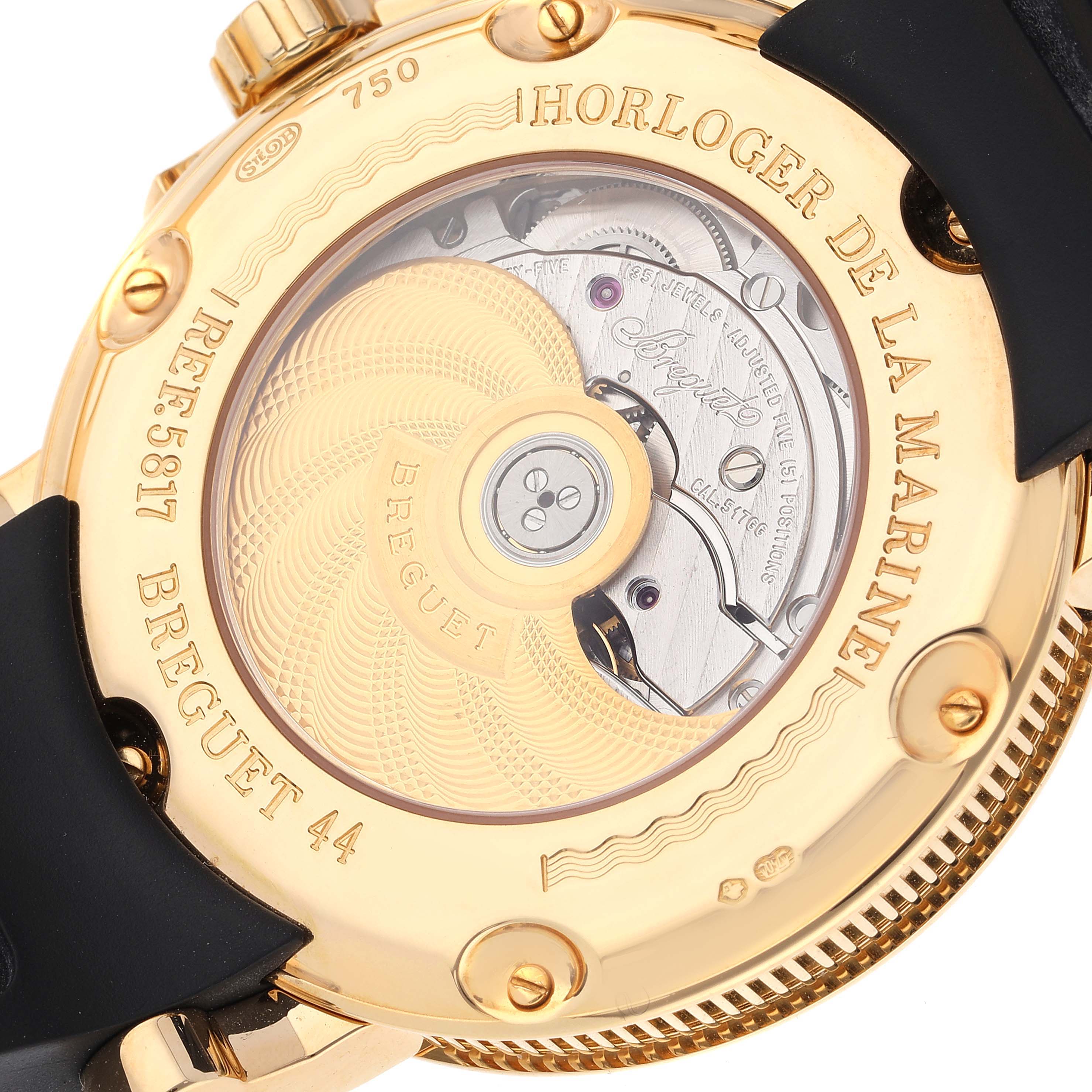 The image shows the case back of a Breguet Marine 5817BA/12/9V8 Men's Yellow Gold Silver Dial 5817BA/12/9V8 Men's Yellow Gold Silver Dial watch, showcasing the movement and engravings.