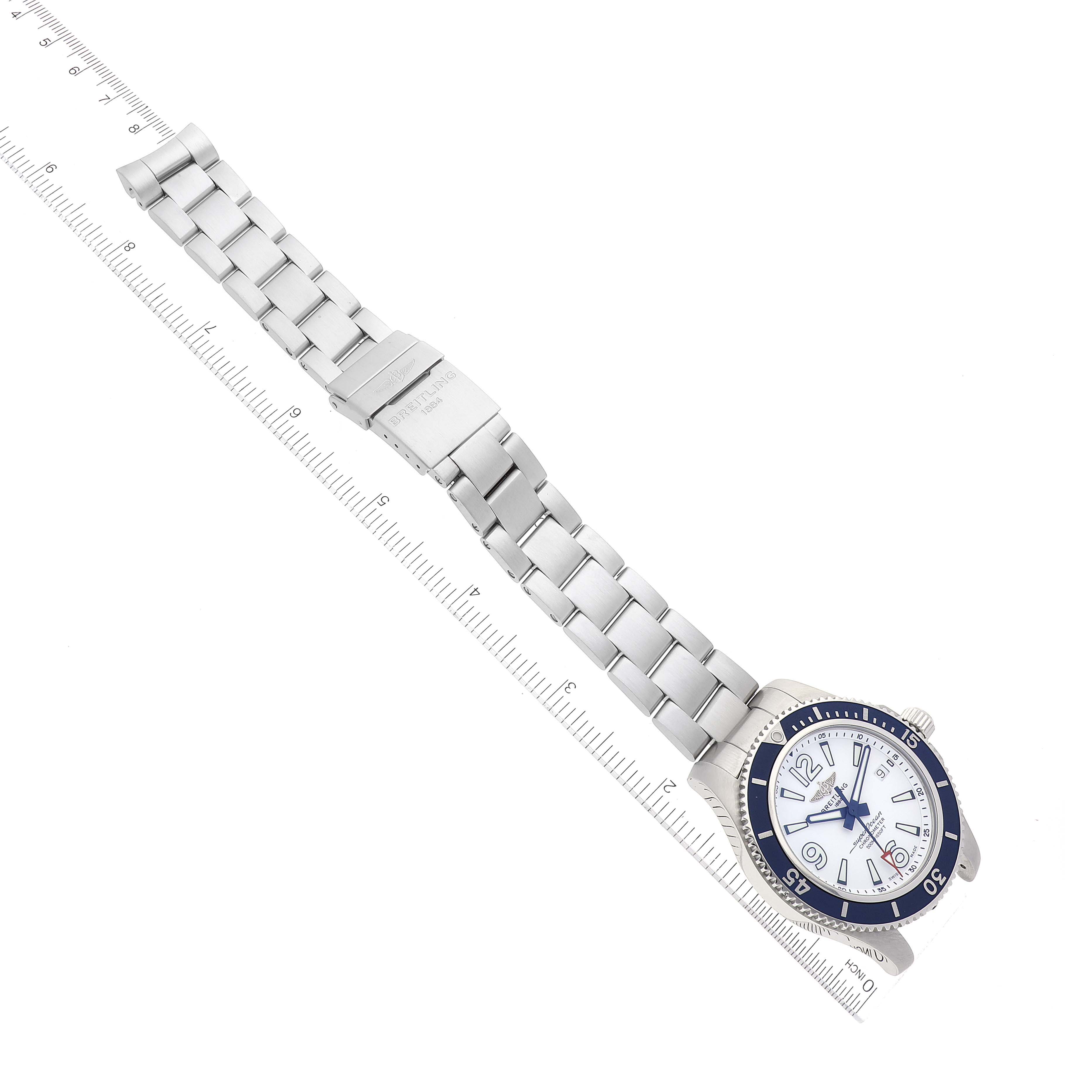 The image shows a Breitling Superocean A17366 Men's Stainless Steel White Dial A17366 Men's Stainless Steel White Dial watch laid flat, highlighting the watch face, bezel, and metal bracelet with a clasp.