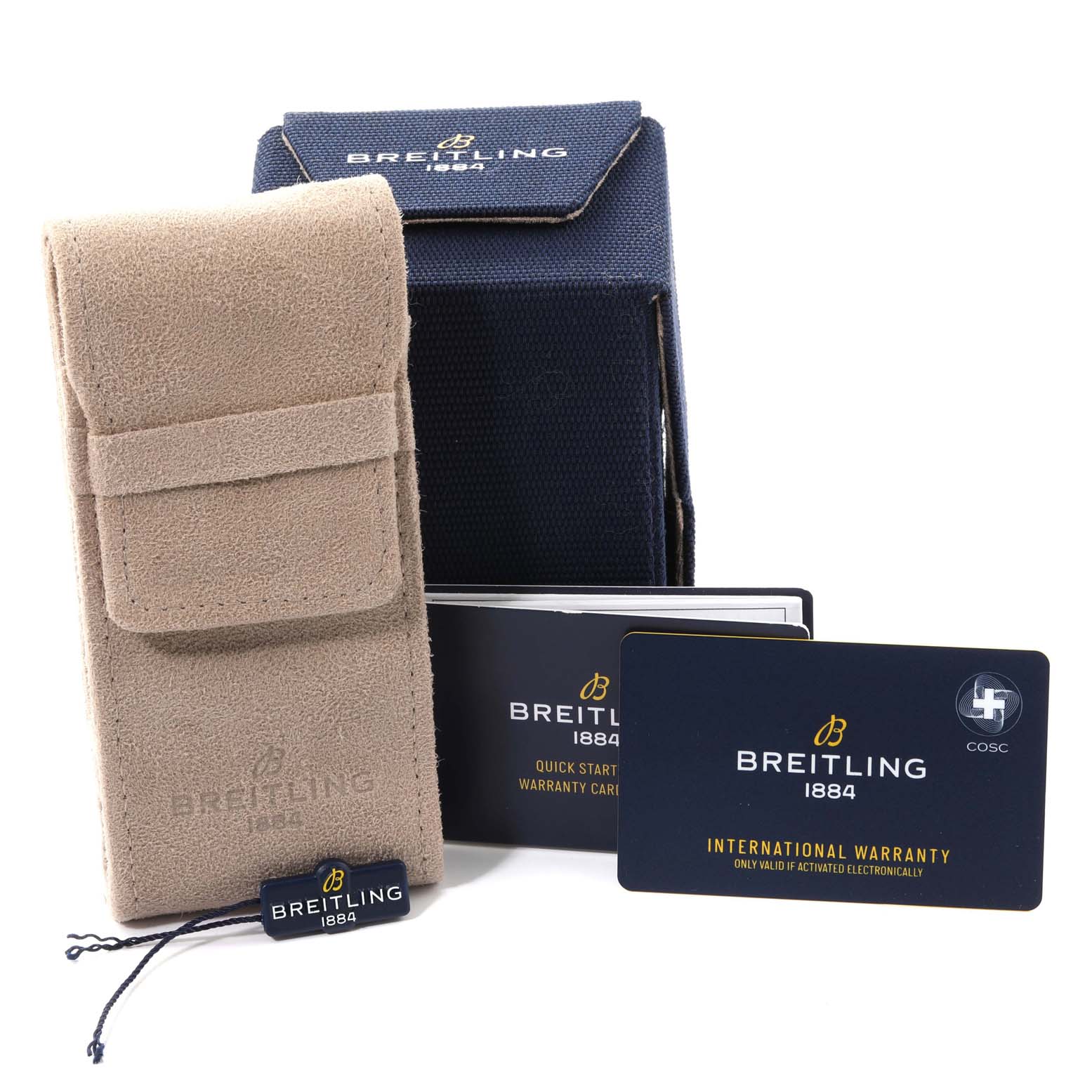 The image shows a beige suede pouch, a blue box, a warranty card, a quick start guide, and a tag for a Breitling Superocean AB2010 Men's Stainless Steel Green Dial AB2010 Men's Stainless Steel Green Dial watch.