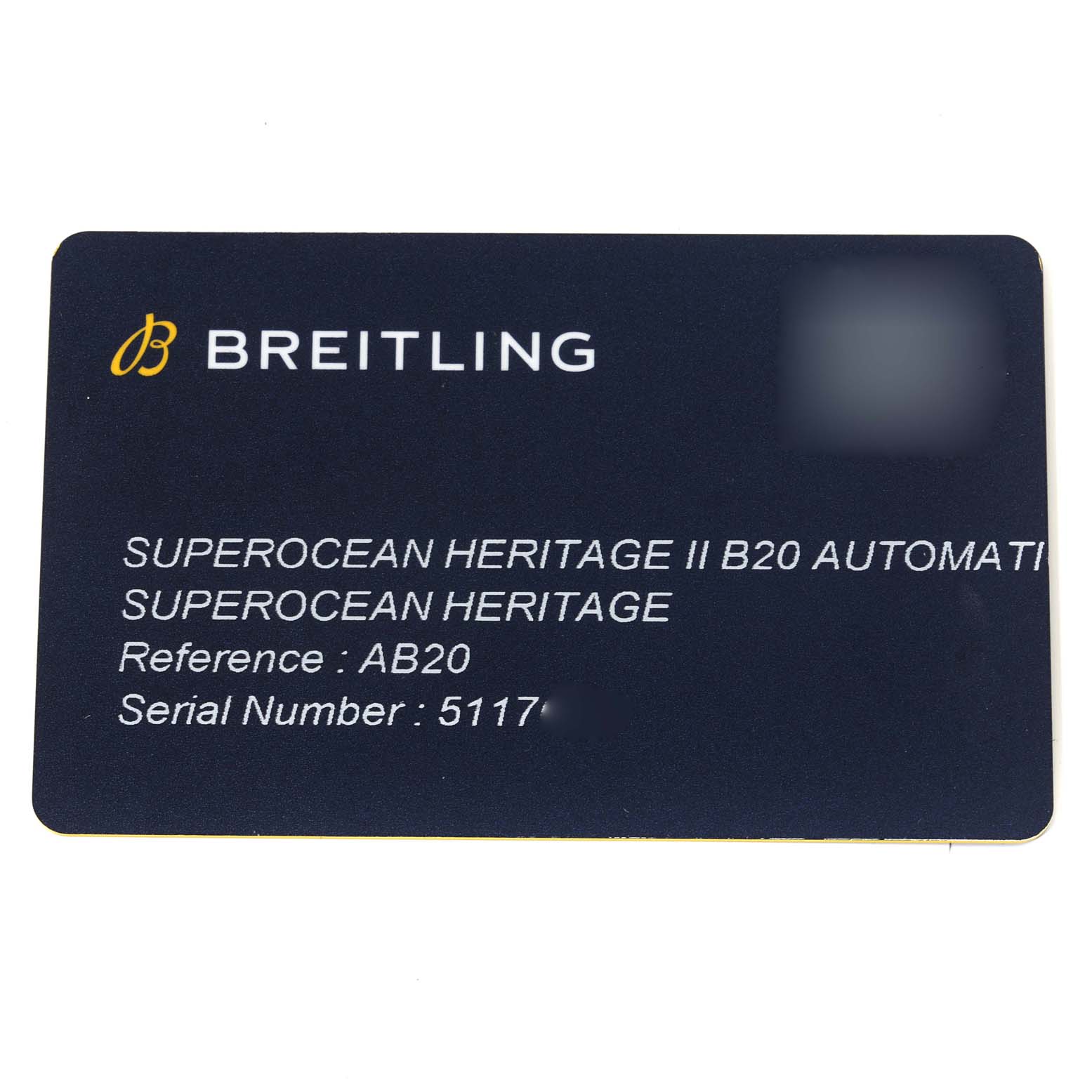 This image shows a Breitling Superocean AB2010 Men's Stainless Steel Green Dial AB2010 Men's Stainless Steel Green Dial Heritage II B20 Automatic reference card with model and serial numbers.