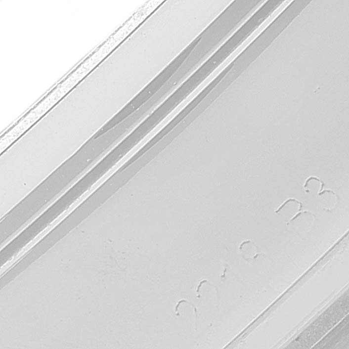 The image shows a close-up of the band of a Breitling Transocean A45310 Men's Stainless Steel Silver Dial A45310 Men's Stainless Steel Silver Dial model, highlighting its engraved detail.