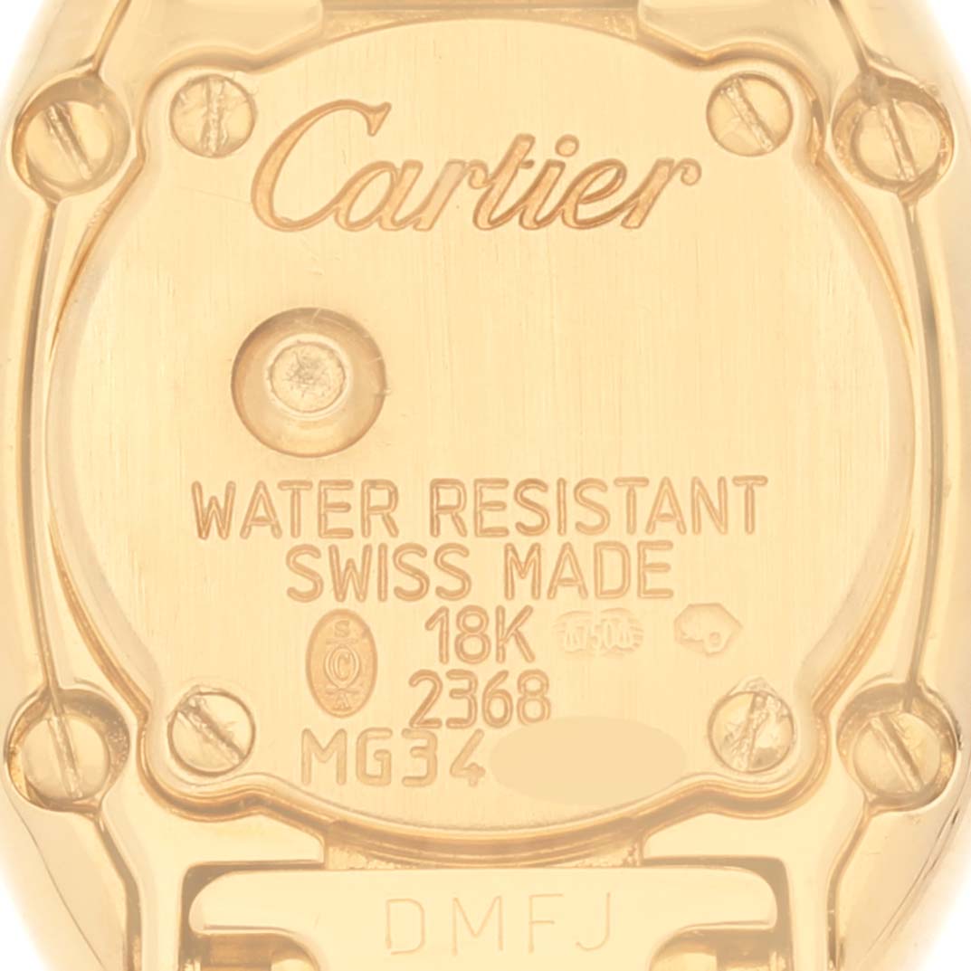 This image shows the back of the Cartier Baignoire WB5094D8 Women's Yellow Gold Silver Dial WB5094D8 Women's Yellow Gold Silver Dial watch, highlighting its markings and specifications.