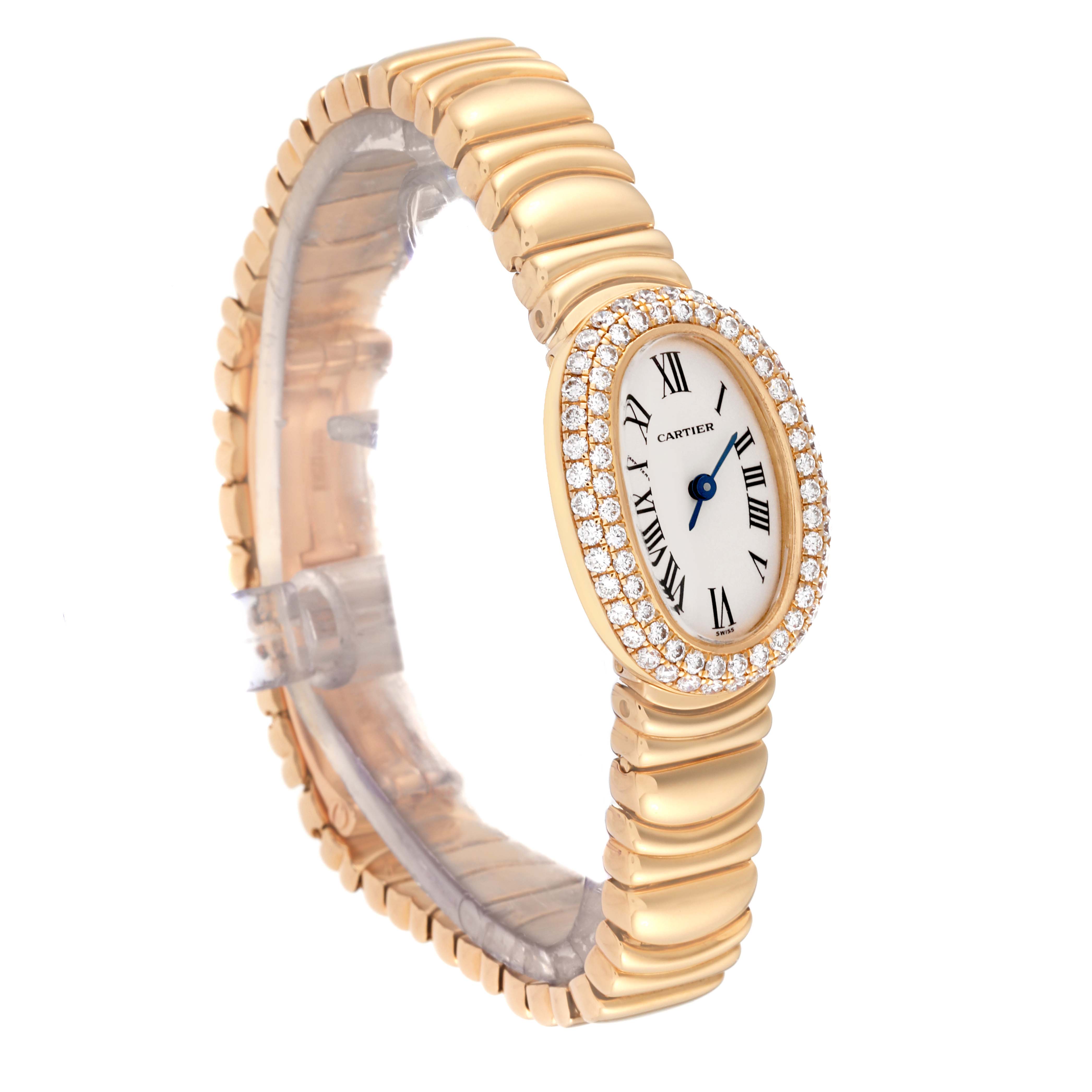 The Cartier Baignoire WB5094D8 Women's Yellow Gold Silver Dial WB5094D8 Women's Yellow Gold Silver Dial watch is shown at a slight angle, displaying its oval face, Roman numerals, diamond bezel, and gold bracelet.