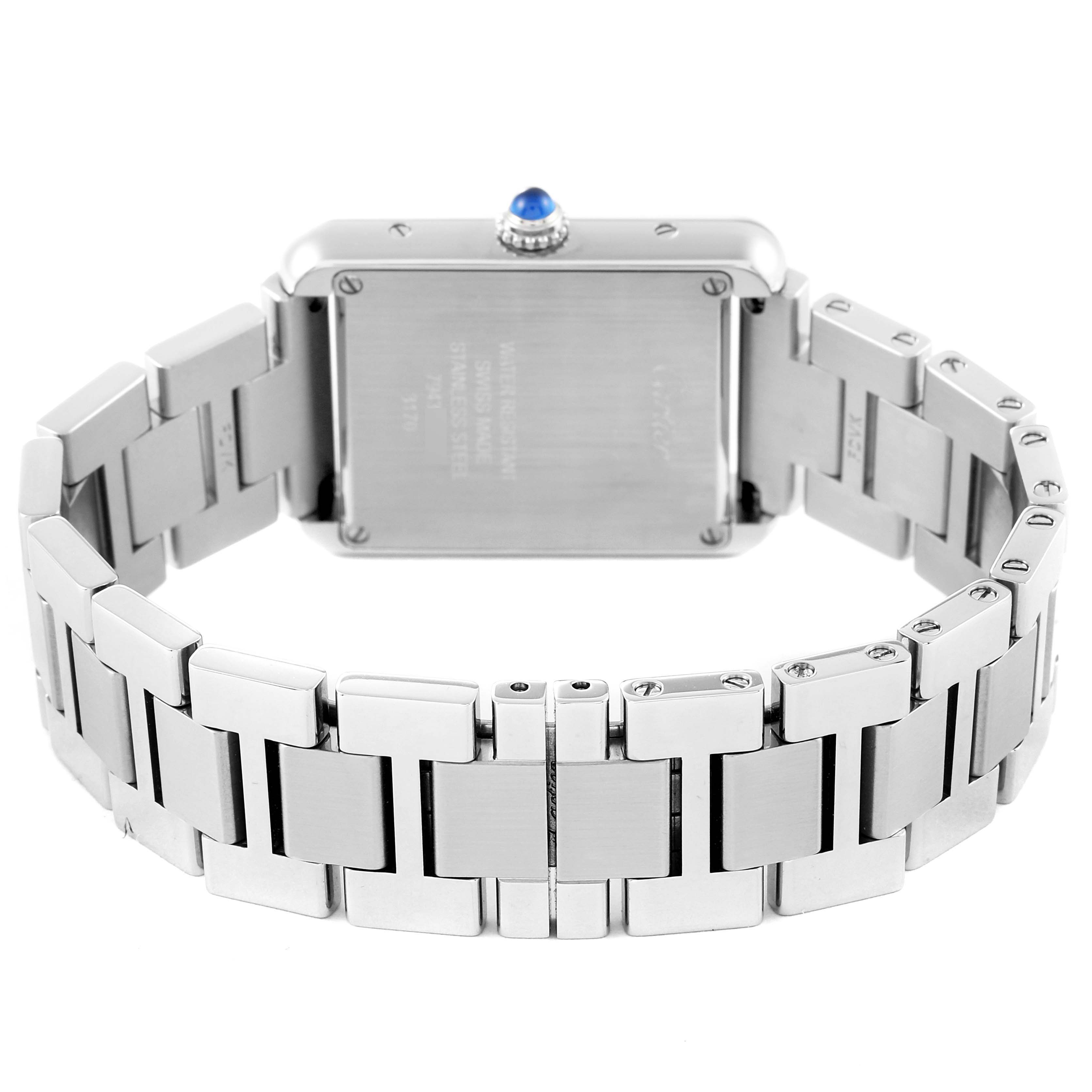 The image shows the back view of the Cartier Tank Solo W5200013 Women's Stainless Steel Silver Dial W5200013 Women's Stainless Steel Silver Dial watch, highlighting its bracelet and back case with a blue cabochon crown.