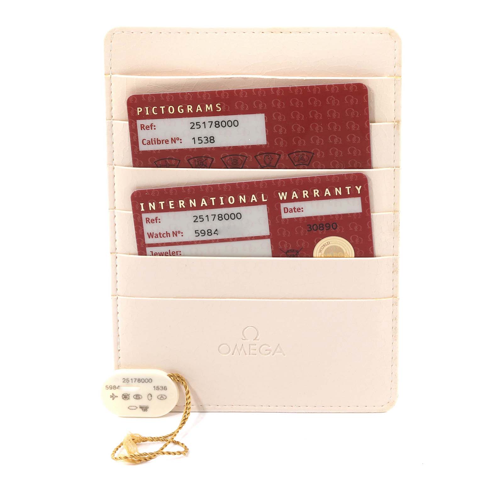 This image shows the warranty and pictograms cards along with a tag for the Omega Aqua Terra 2517.80.00 Men
s Stainless Steel Blue Dial 2517.80.00 Men
s Stainless Steel Blue Dial watch model.