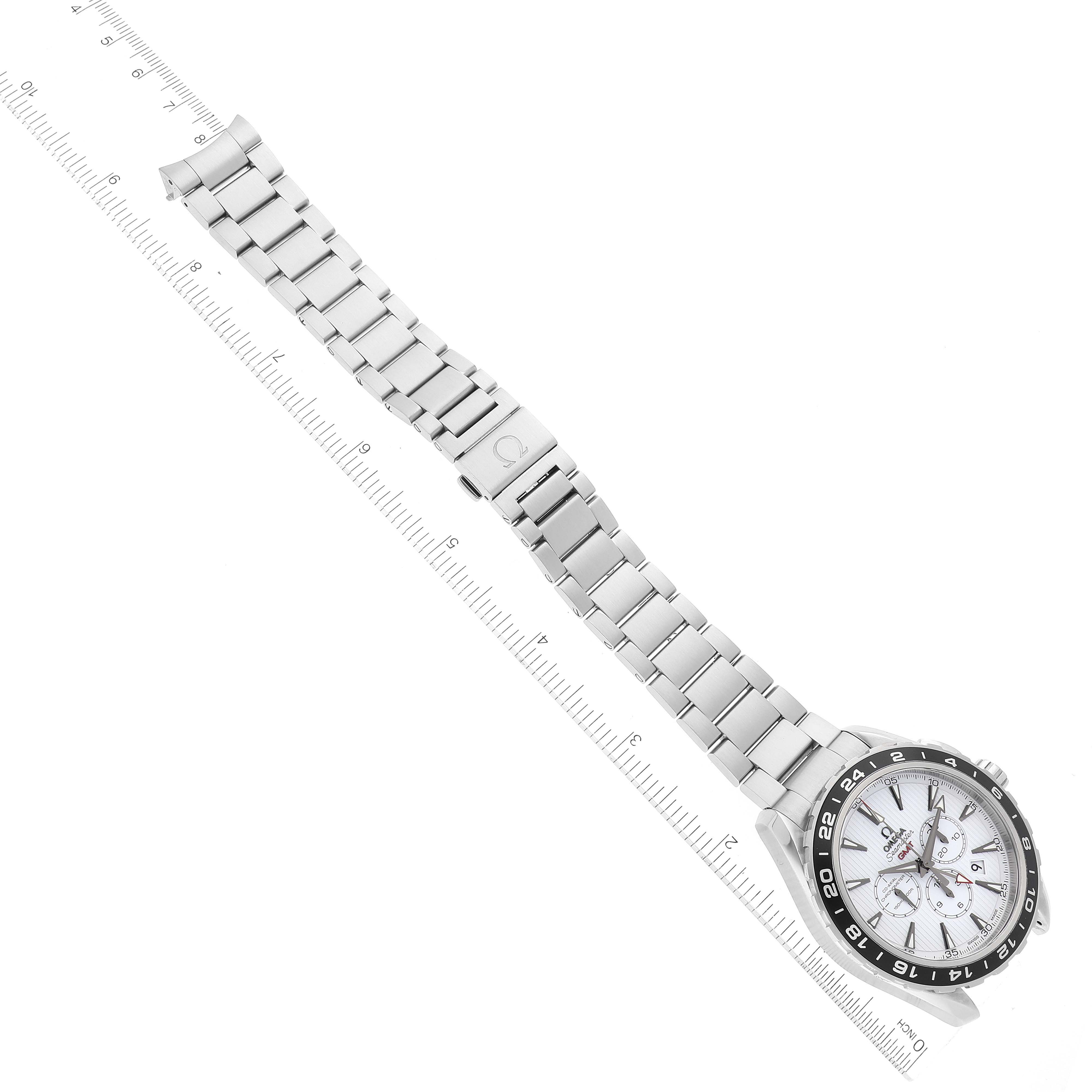 The image shows an Omega Aqua Terra 231.10.44.52.04.001 Men
s Stainless Steel White Dial 231.10.44.52.04.001 Men
s Stainless Steel White Dial watch placed at an angle with the entire bracelet and clasp visible alongside a ruler.