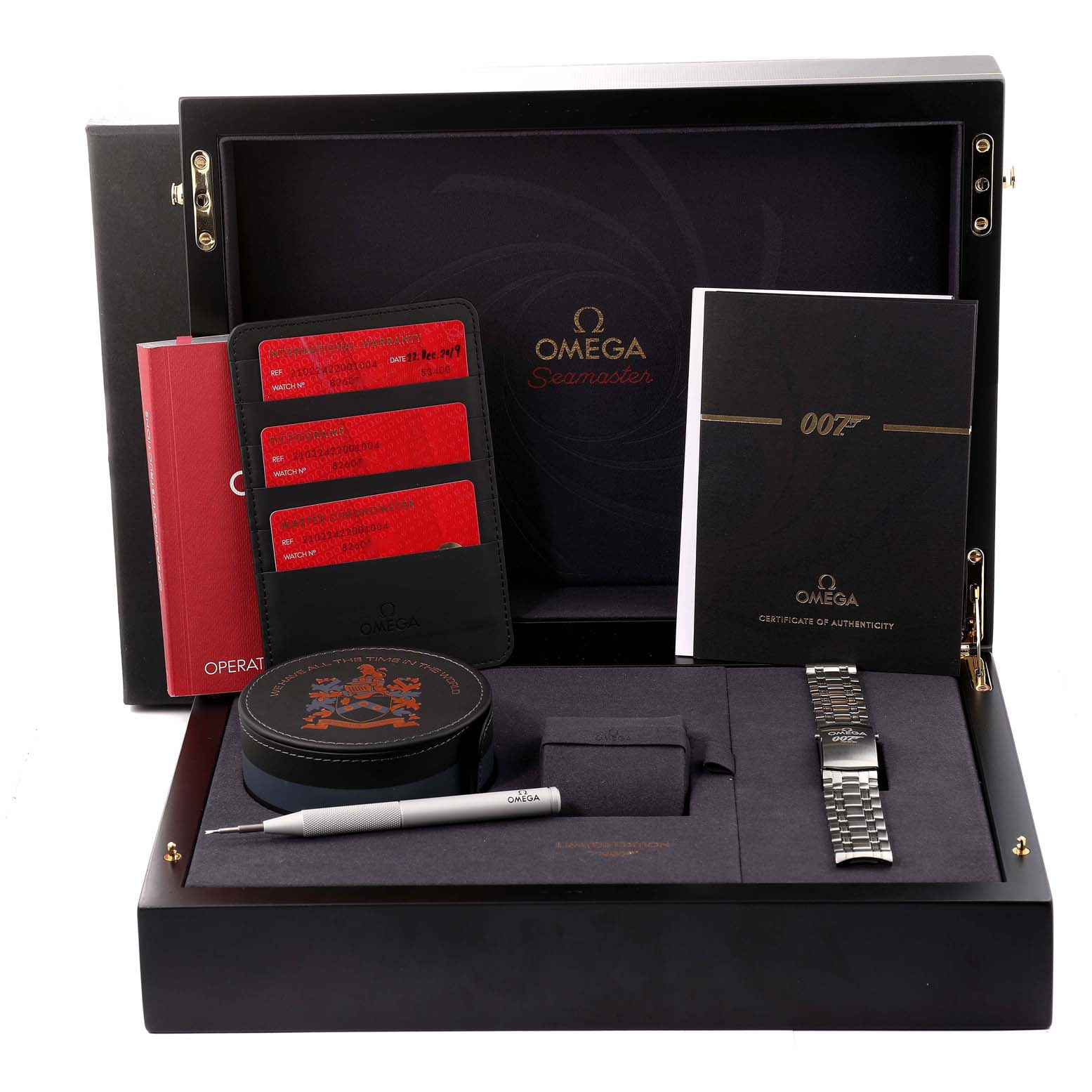 This Omega Seamaster 210.22.42.20.01.004 Men's Stainless Steel Black Dial 210.22.42.20.01.004 Men's Stainless Steel Black Dial set includes authenticity cards, an instruction manual, a steel bracelet, a booklet, and a tool, viewed from above.