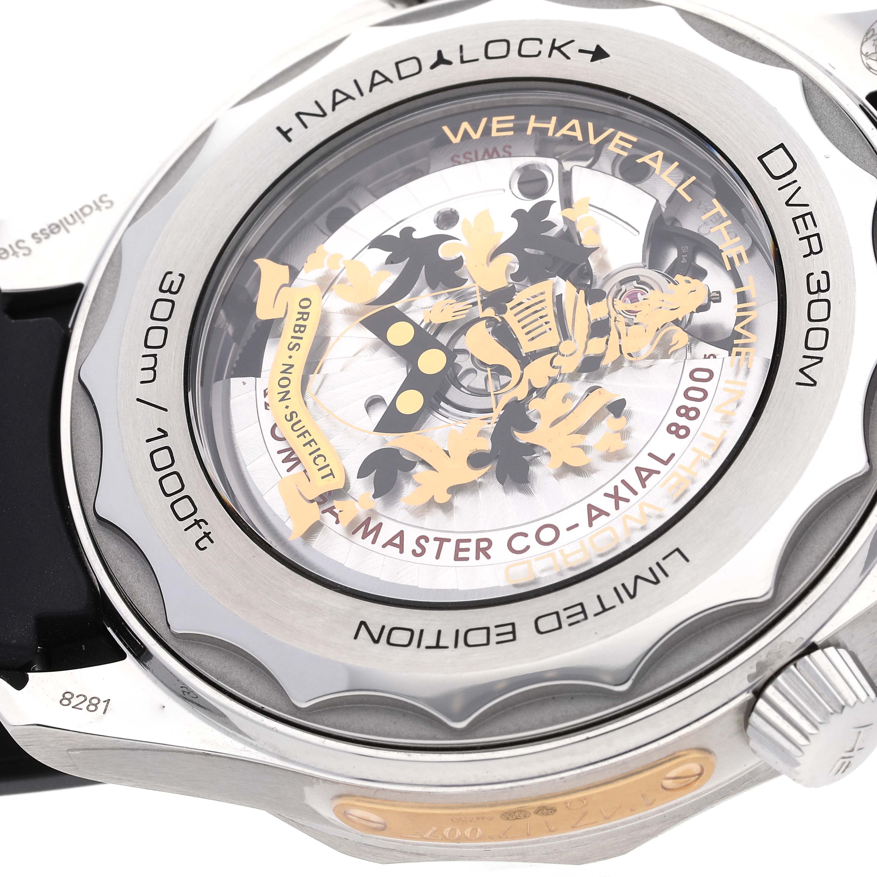 The image shows the back of an Omega Seamaster 210.22.42.20.01.004 Men
s Stainless Steel Black Dial 210.22.42.20.01.004 Men
s Stainless Steel Black Dial Diver 300M, displaying its movement and Naiad Lock system.