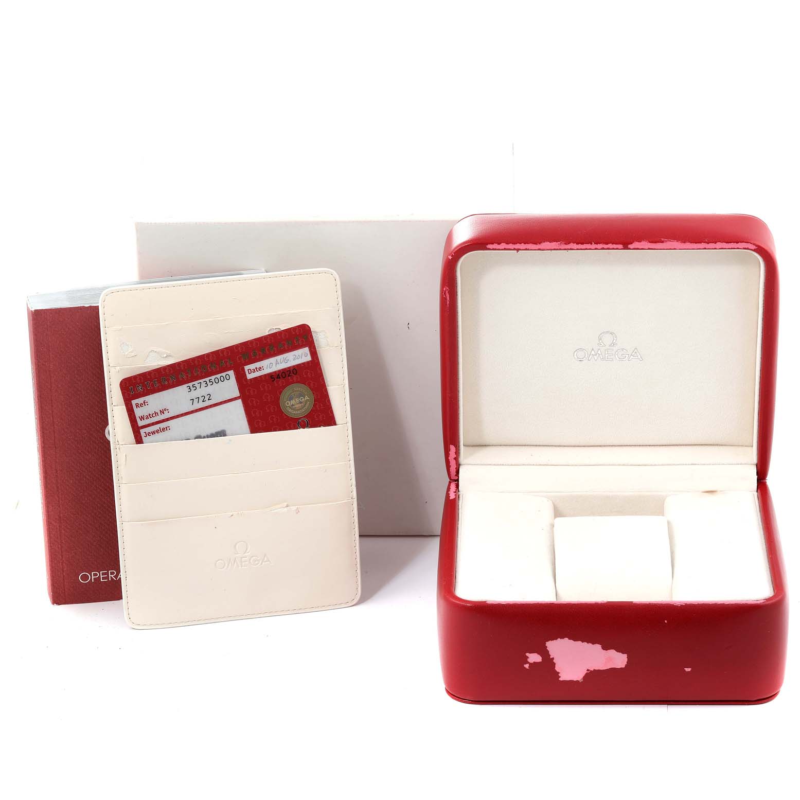 The image shows the packaging and accessories for an Omega Speedmaster 3573.50.00 Men's Stainless Steel Black Dial 3573.50.00 Men's Stainless Steel Black Dial, including a red watch box, warranty cards, and an instruction booklet.