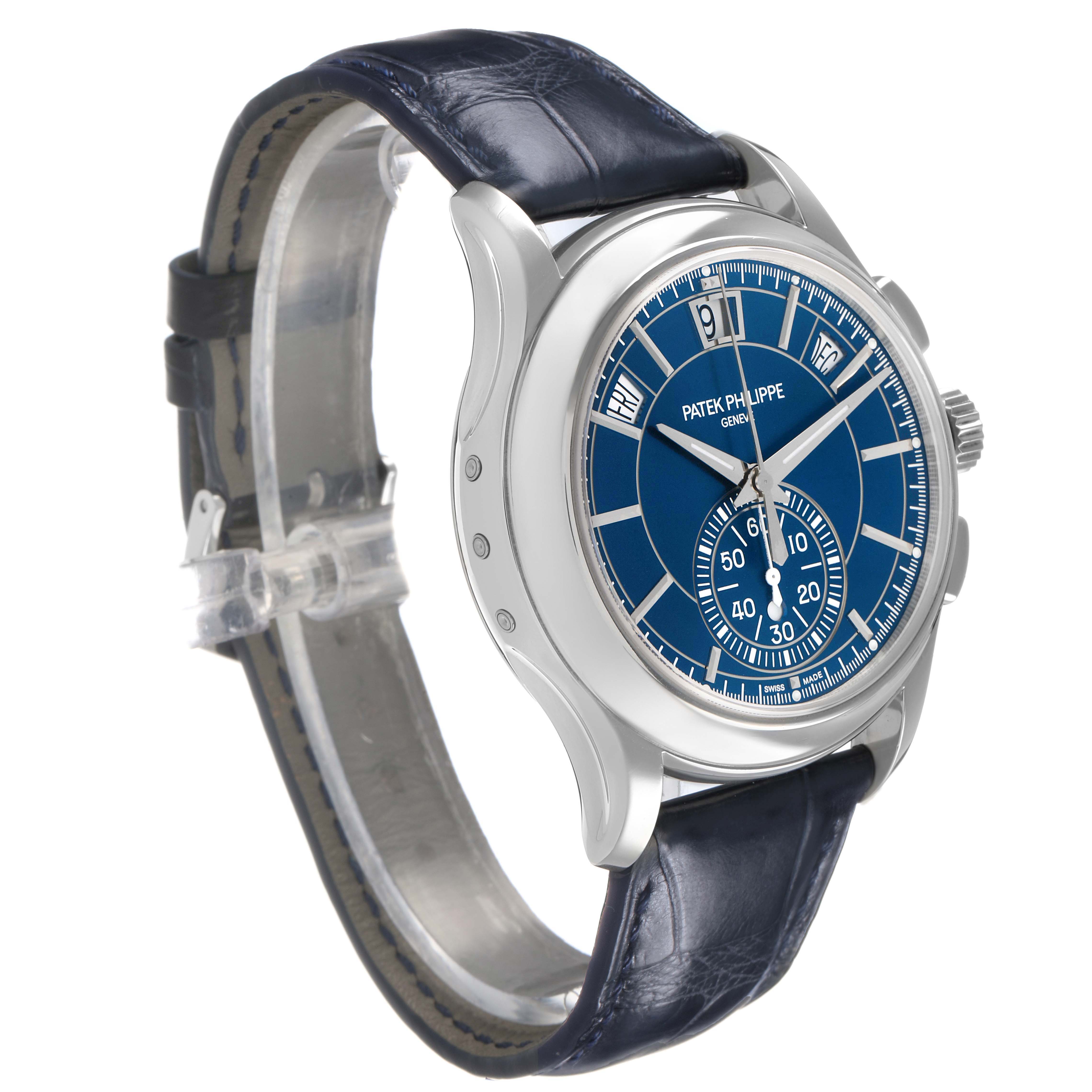 The Patek Philippe Complications 5905P - 001 Men's Platinum Blue Dial watch is shown at a three-quarter angle, displaying the blue dial, case, crown, and leather strap.