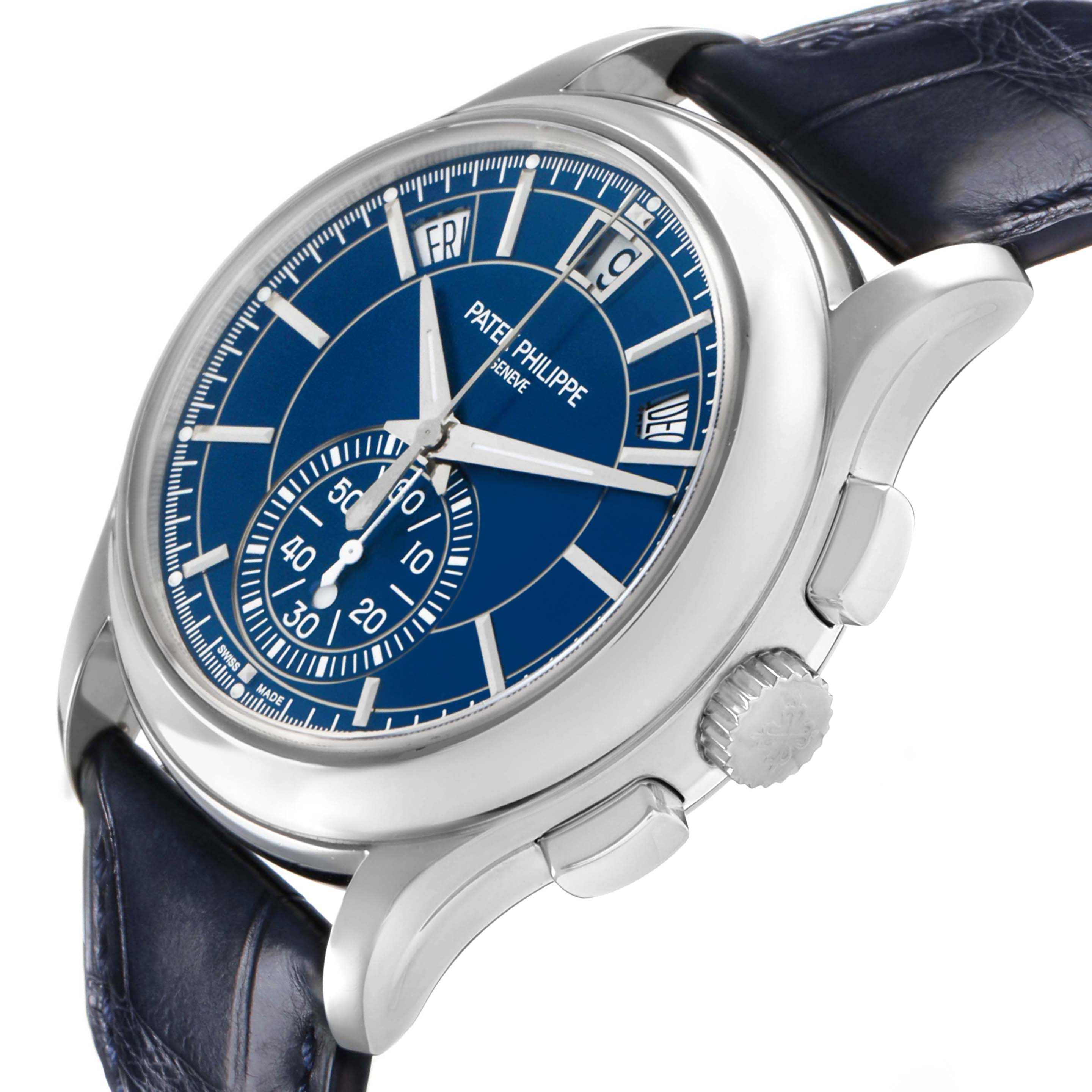 The Patek Philippe Complications 5905P - 001 Men's Platinum Blue Dial watch is shown at a three-quarter angle, highlighting the blue dial, crown, and pushers.