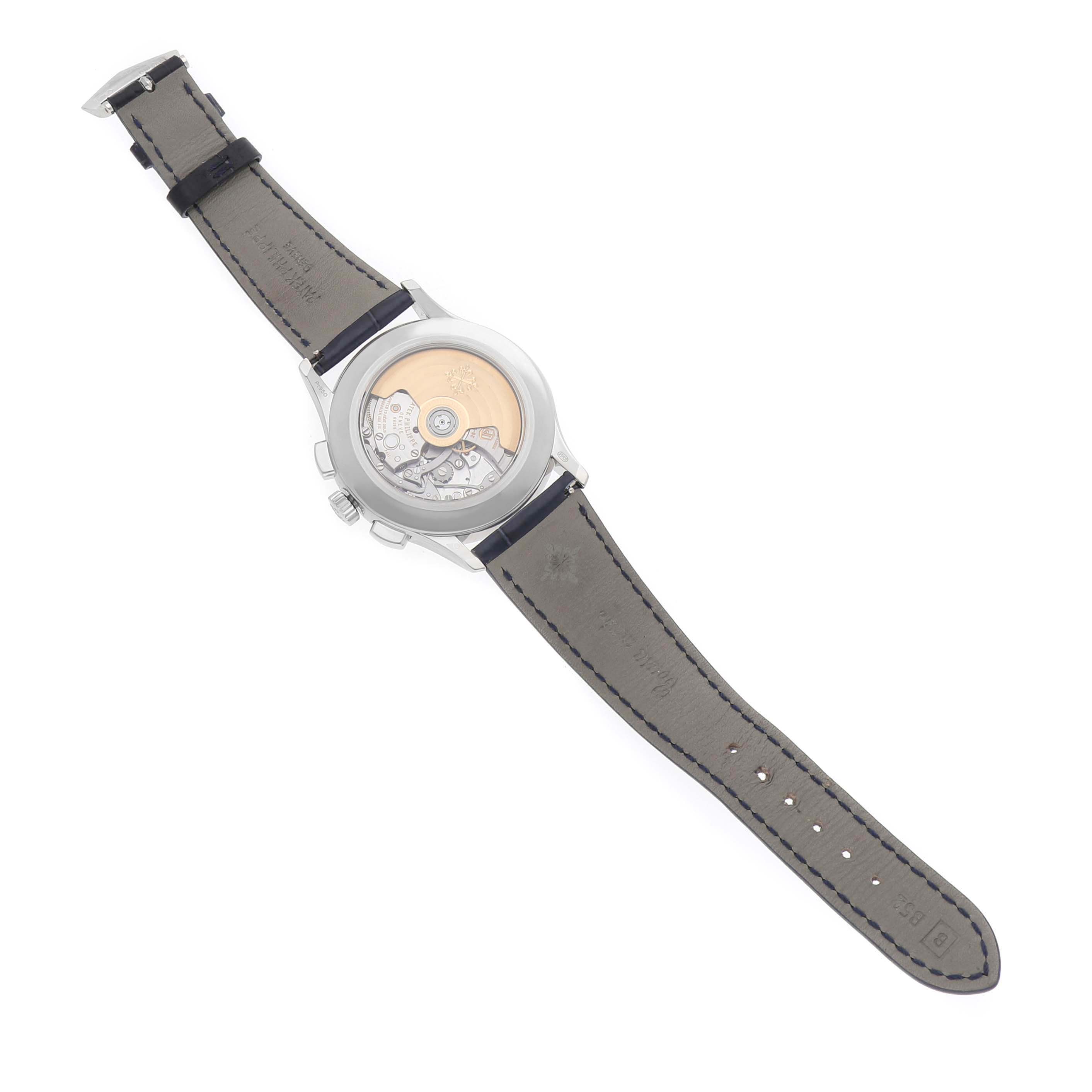 The Patek Philippe Complications 5905P - 001 Men's Platinum Blue Dial model is shown from the back, featuring its exposed movement and full leather strap.