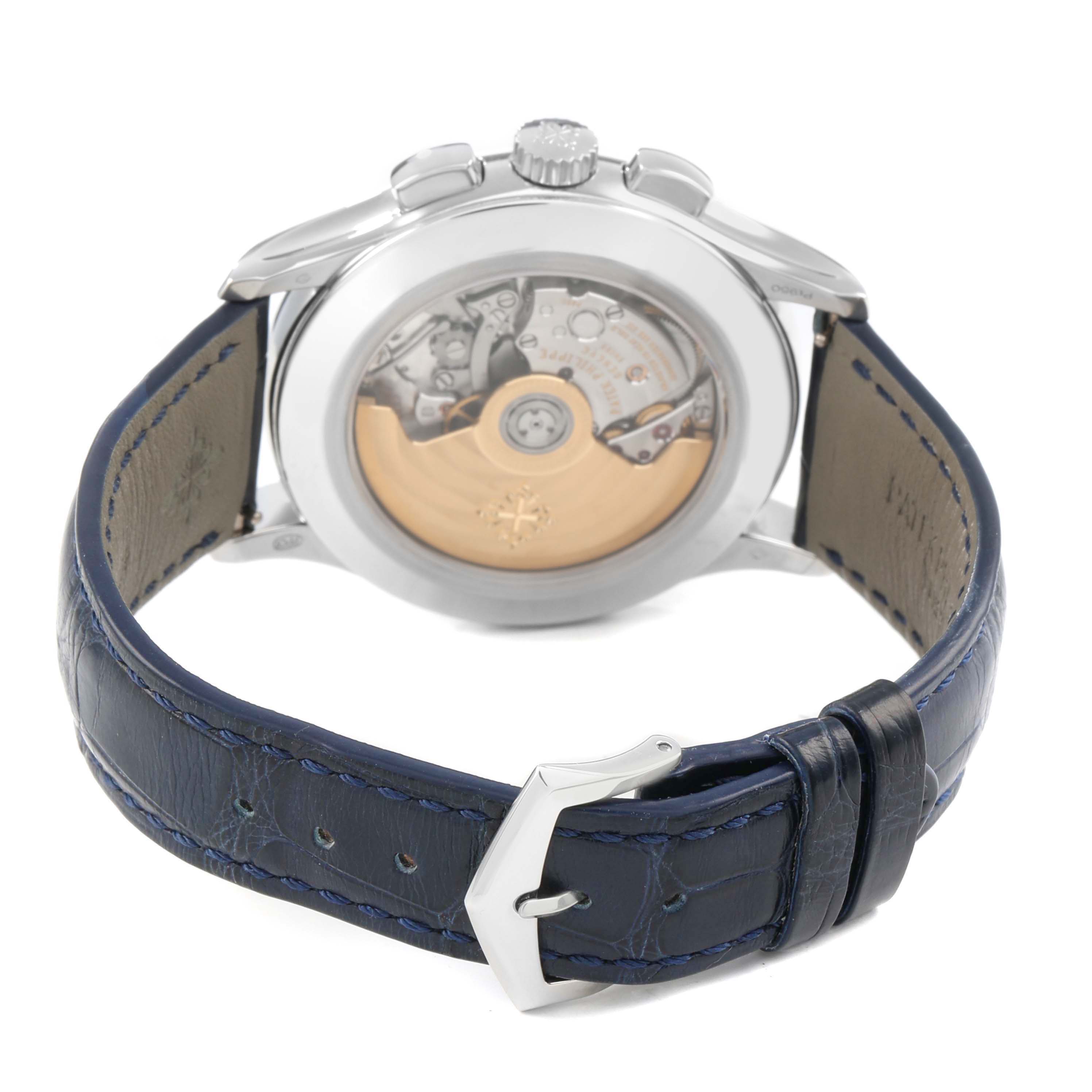 The Patek Philippe Complications 5905P - 001 Men's Platinum Blue Dial model is shown from the back, highlighting the movement and blue leather strap.