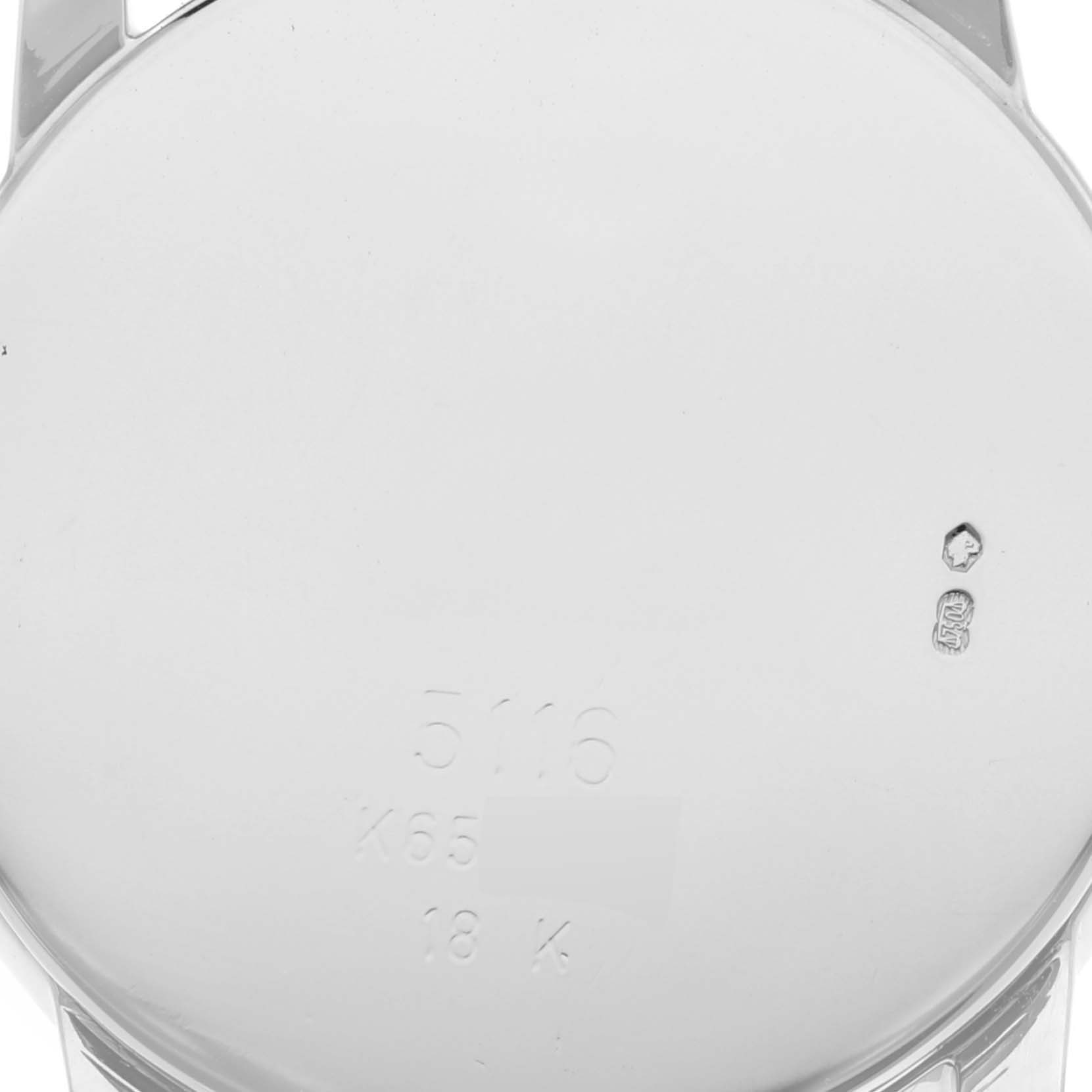 The image shows the back case of a Rolex Cellini 5116 Men's White Gold Grey Dial 5116 Men's White Gold Grey Dial watch, displaying its engravings and hallmarks.