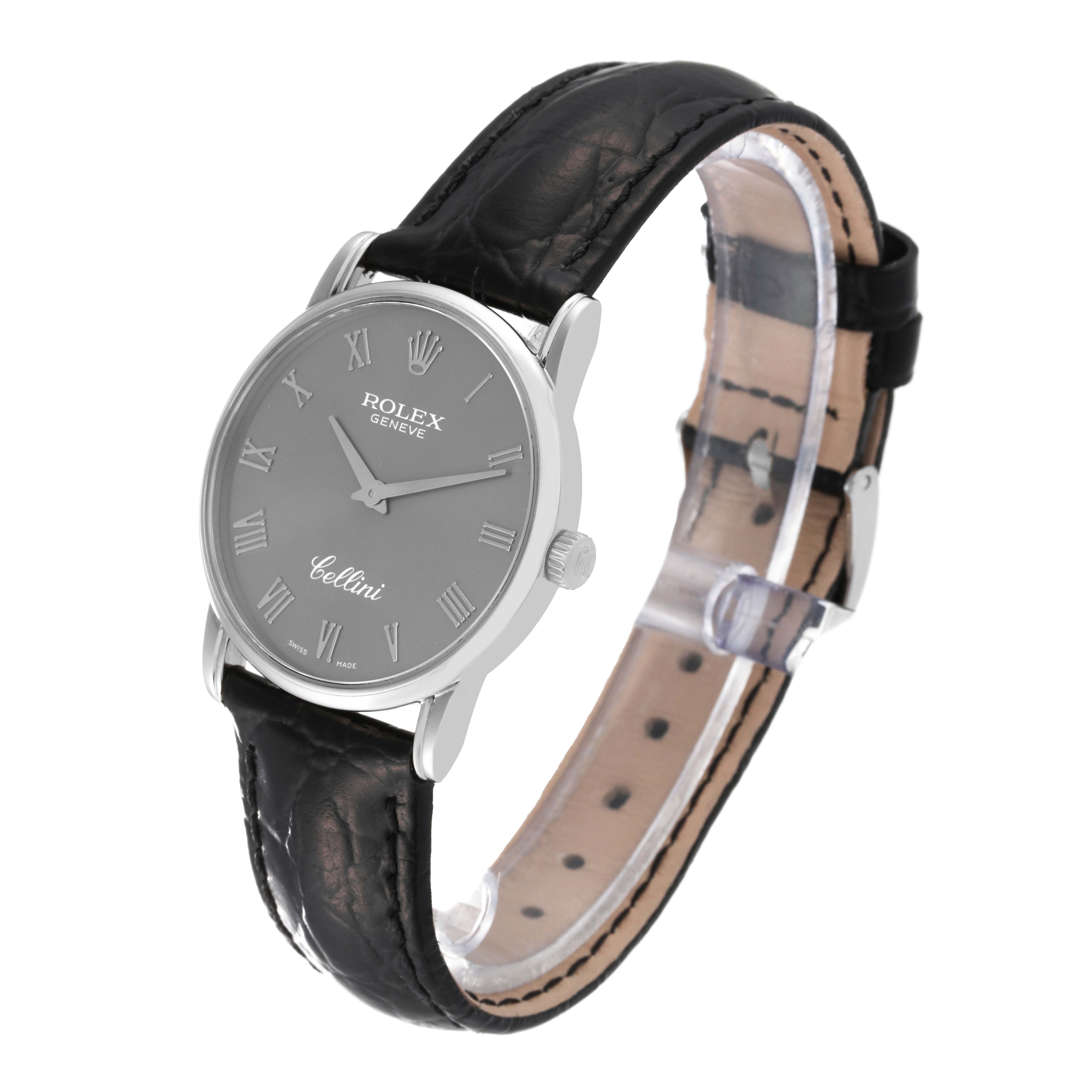 This image shows a Rolex Cellini 5116 Men's White Gold Grey Dial 5116 Men's White Gold Grey Dial watch at a three-quarter angle, highlighting the face, crown, and black leather strap.