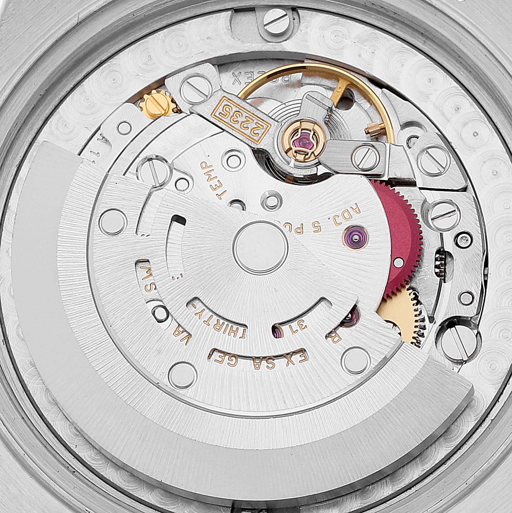 This image shows the inner mechanical movement of a Mid-Size Rolex watch, viewed from the back angle.