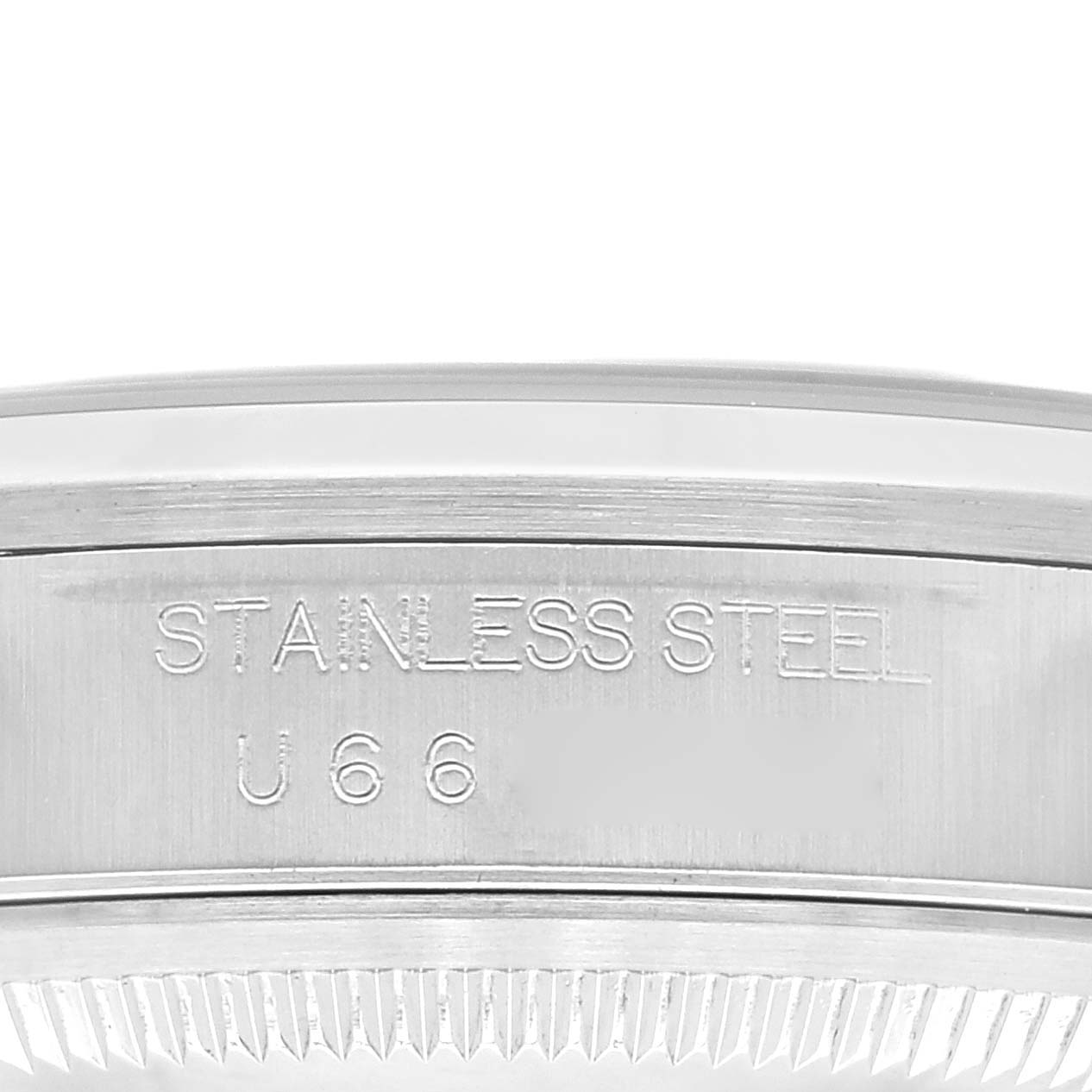 This image shows a macro shot of the stainless steel engraving on the case back edge of a Rolex Datejust 16200 Men's Stainless Steel Pink Dial 16200 Men's Stainless Steel Pink Dial watch.