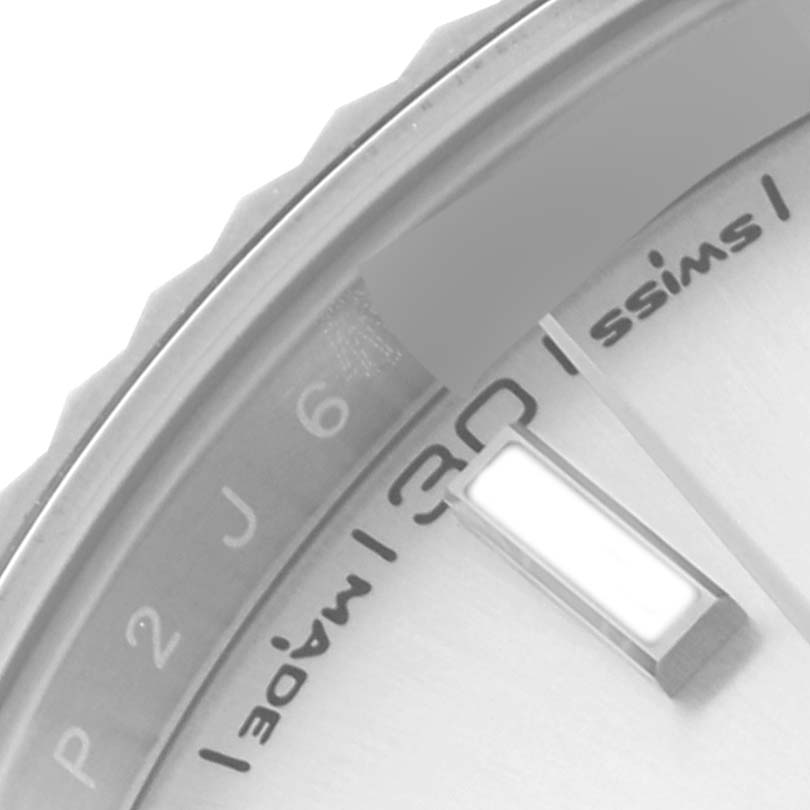 The image shows a close-up of the Rolex Datejust 41 126334 Men
s Stainless Steel Silver Dial 126334 Men
s Stainless Steel Silver Dial
s dial, focusing on the bezel, markers, and part of the date window.