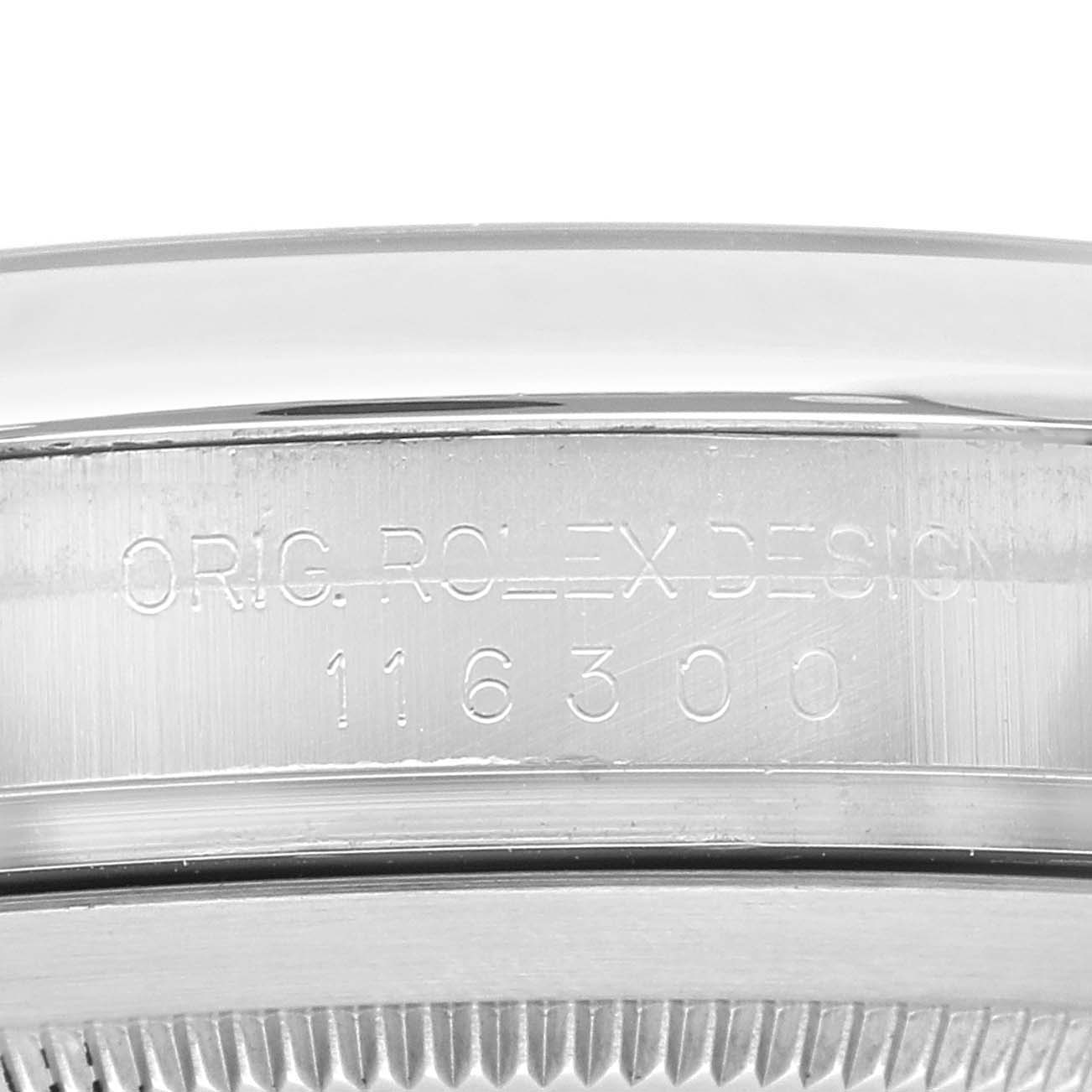 This is a close-up shot of the watch case side of a Rolex Datejust 41 116300 Men
s Stainless Steel Blue Dial 116300 Men
s Stainless Steel Blue Dial, showing the model number and "ORIG. ROLEX DESIGN" engraving.