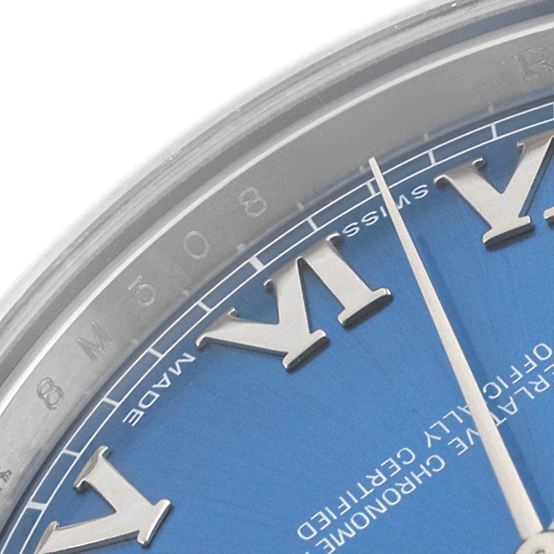 This close-up of the Rolex Datejust 41 116300 Men
s Stainless Steel Blue Dial 116300 Men
s Stainless Steel Blue Dial model shows part of the blue dial, Roman numeral hour markers, and a portion of the bezel.
