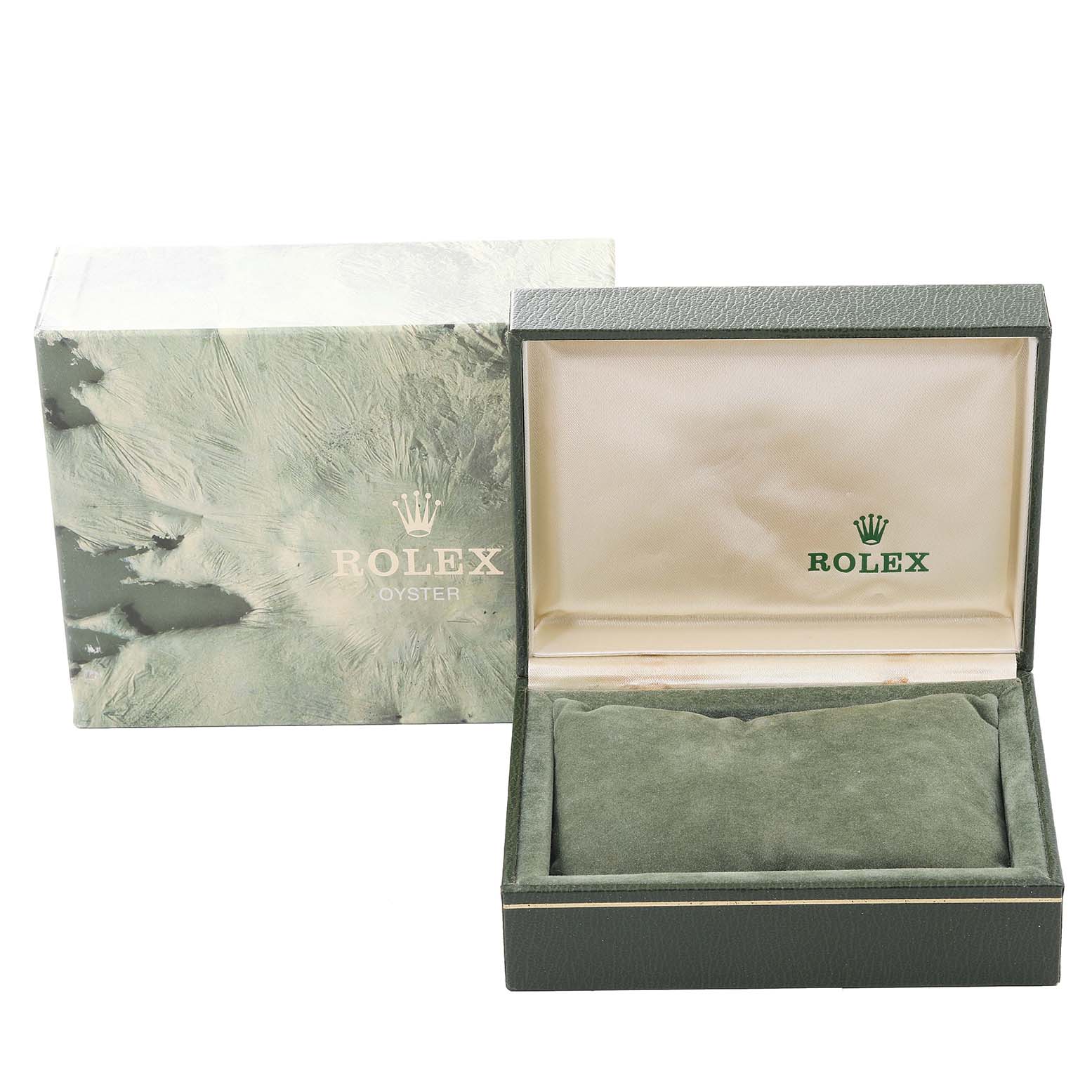 This image shows an open green Rolex Oyster box with its lid leaning against the outer packaging.