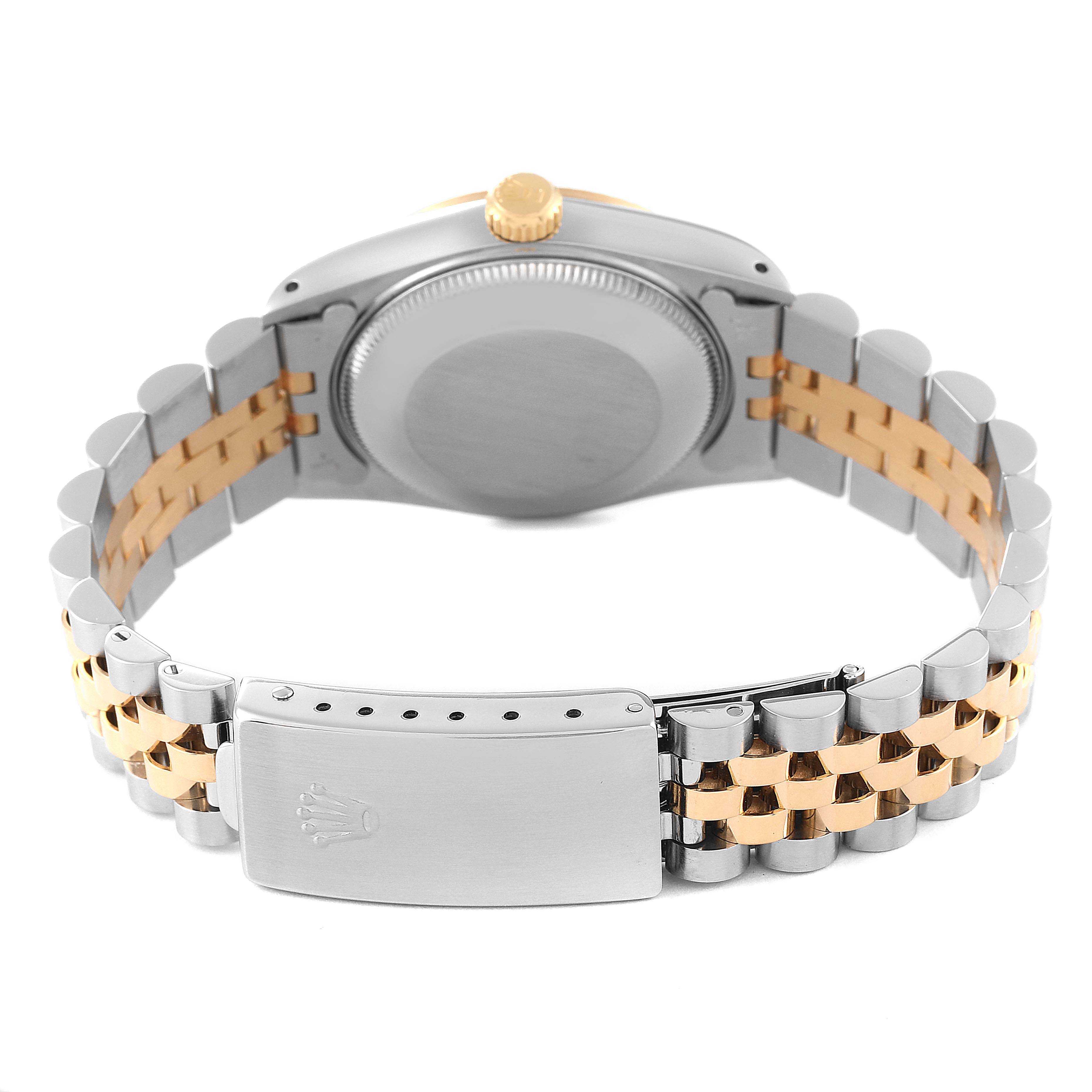 The image shows the back of a Rolex Mid-Size 68273 Women
s Steel and Gold (two tone) White Dial 68273 Women
s Steel and Gold (two tone) White Dial model watch, highlighting its two-tone bracelet and clasp.