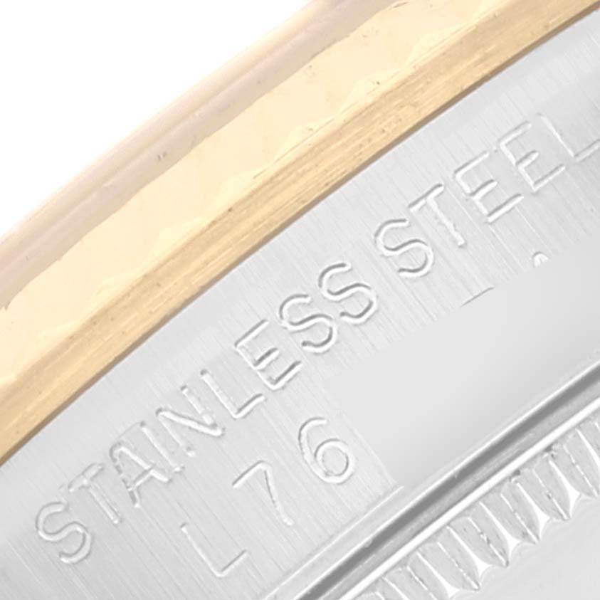 This close-up image shows the engraved stainless steel case back of a Mid-Size Rolex watch.