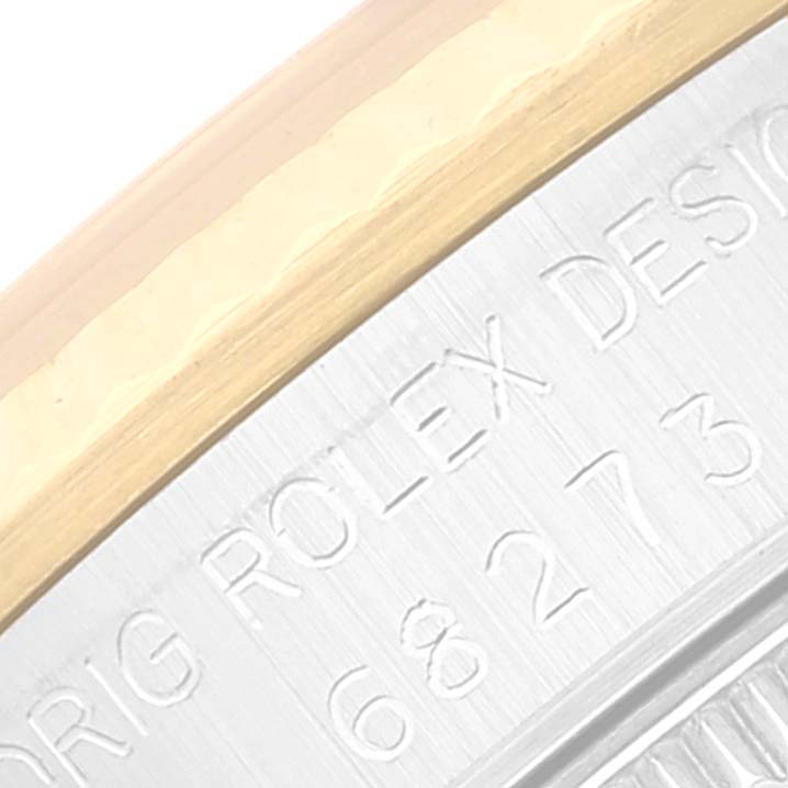 This close-up image shows the case and engraving details of a Mid-Size Rolex watch.