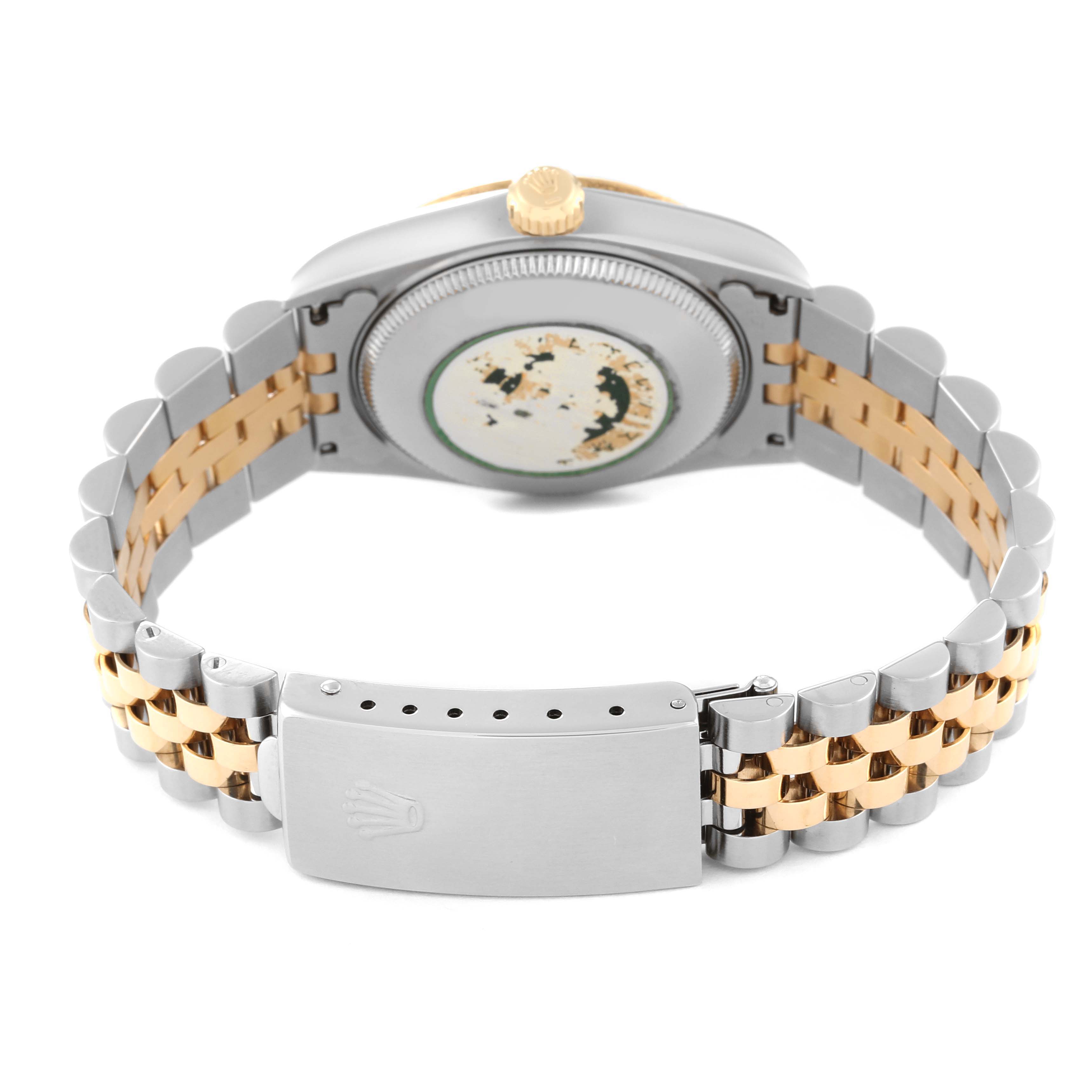 The image shows the back view of a Rolex Mid-Size 78273 Women's Steel and Gold (two tone) Black Dial 78273 Women's Steel and Gold (two tone) Black Dial model watch, including the case back, crown, and two-tone bracelet with the clasp. 