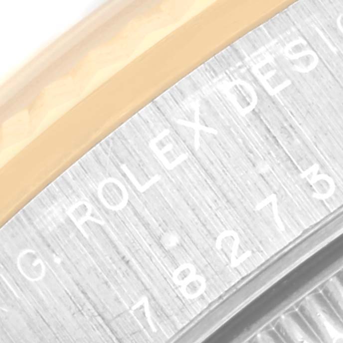 The image shows a close-up of the model number engraving on a Mid-Size Rolex watch case.