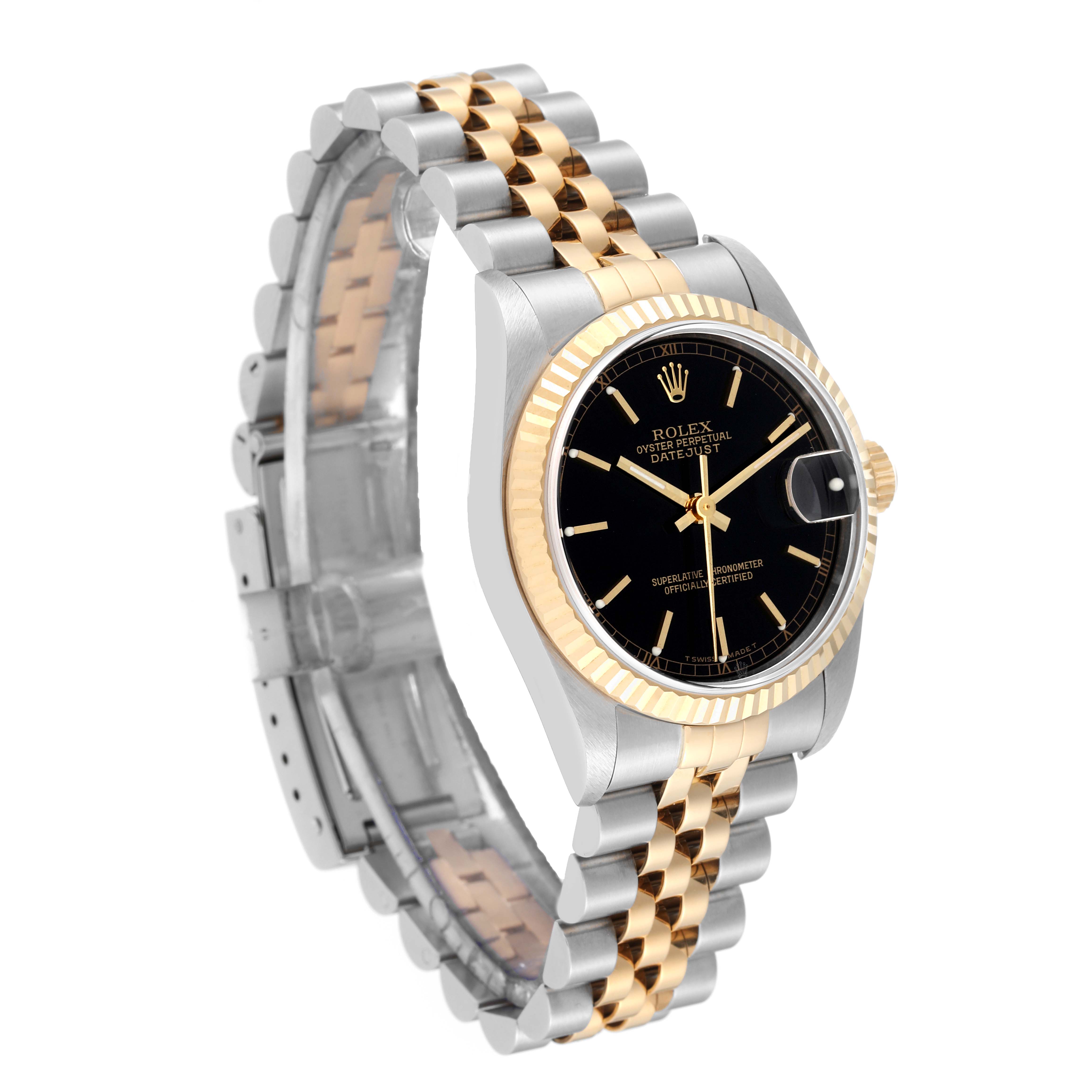 The image shows a side angle of the Rolex Mid-Size 78273 Women's Steel and Gold (two tone) Black Dial 78273 Women's Steel and Gold (two tone) Black Dial Datejust, highlighting its two-tone bracelet, black dial, and fluted bezel.