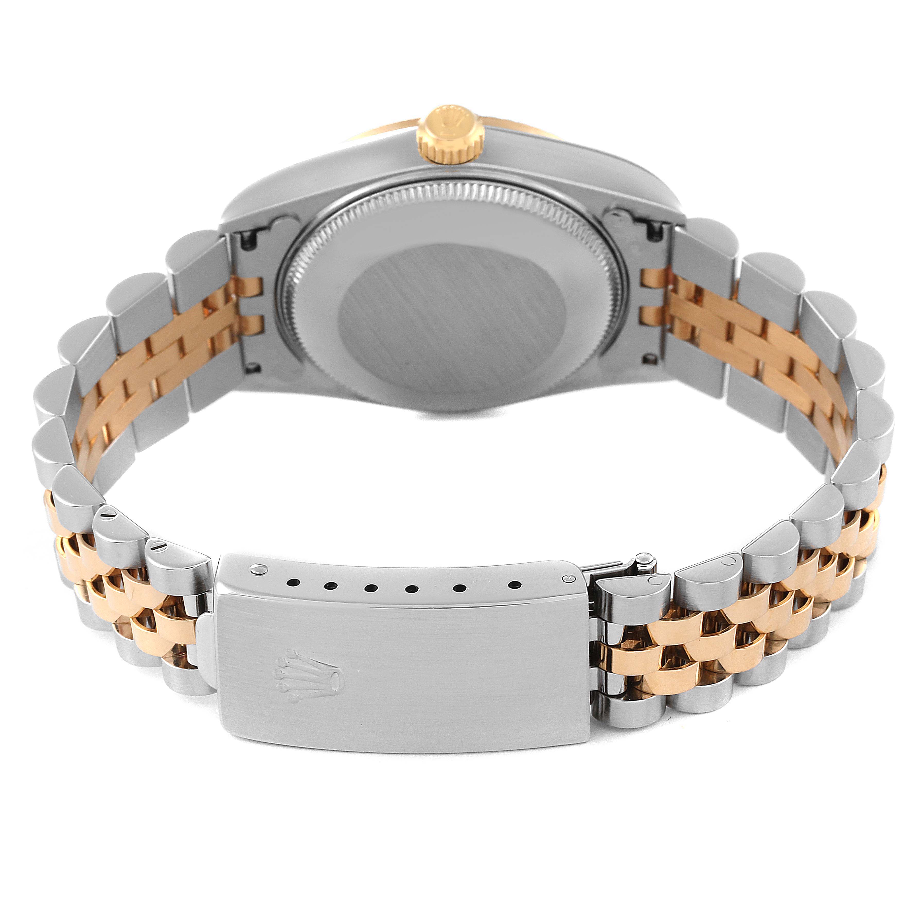 This image shows the back of a Mid-Size Rolex watch, highlighting the case, clasp, and two-tone bracelet.