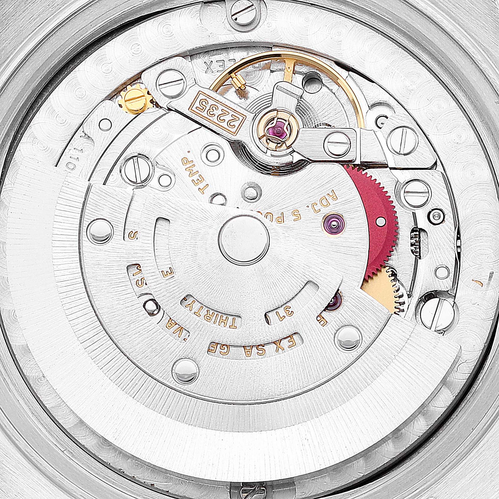 This close-up image shows the internal mechanical movement of a Mid-Size Rolex watch.
