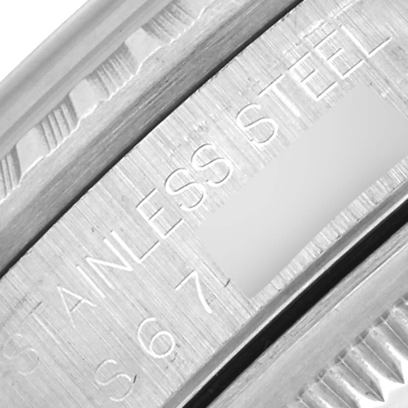 The image shows a close-up of the flange with engravings on a Rolex Datejust 16220 Men's Stainless Steel Silver Dial 16220 Men's Stainless Steel Silver Dial, focusing on "STAINLESS STEEL."