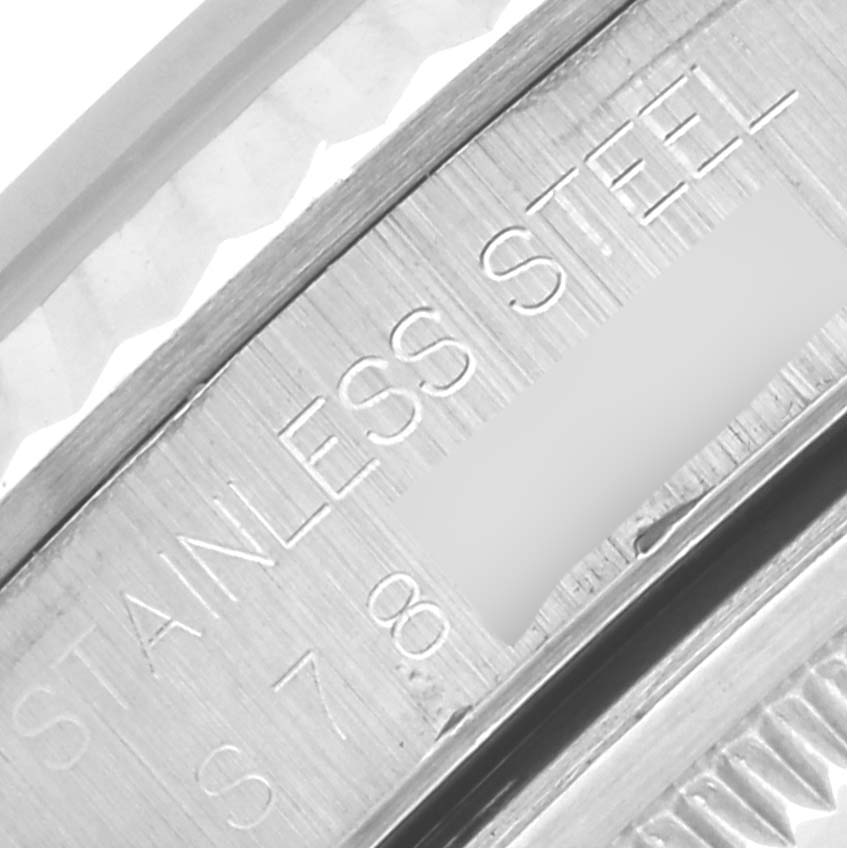 The image shows a close-up of the side engraving on a Rolex Datejust 16234 Men's Stainless Steel Beige Dial 16234 Men's Stainless Steel Beige Dial watch, highlighting "STAINLESS STEEL."