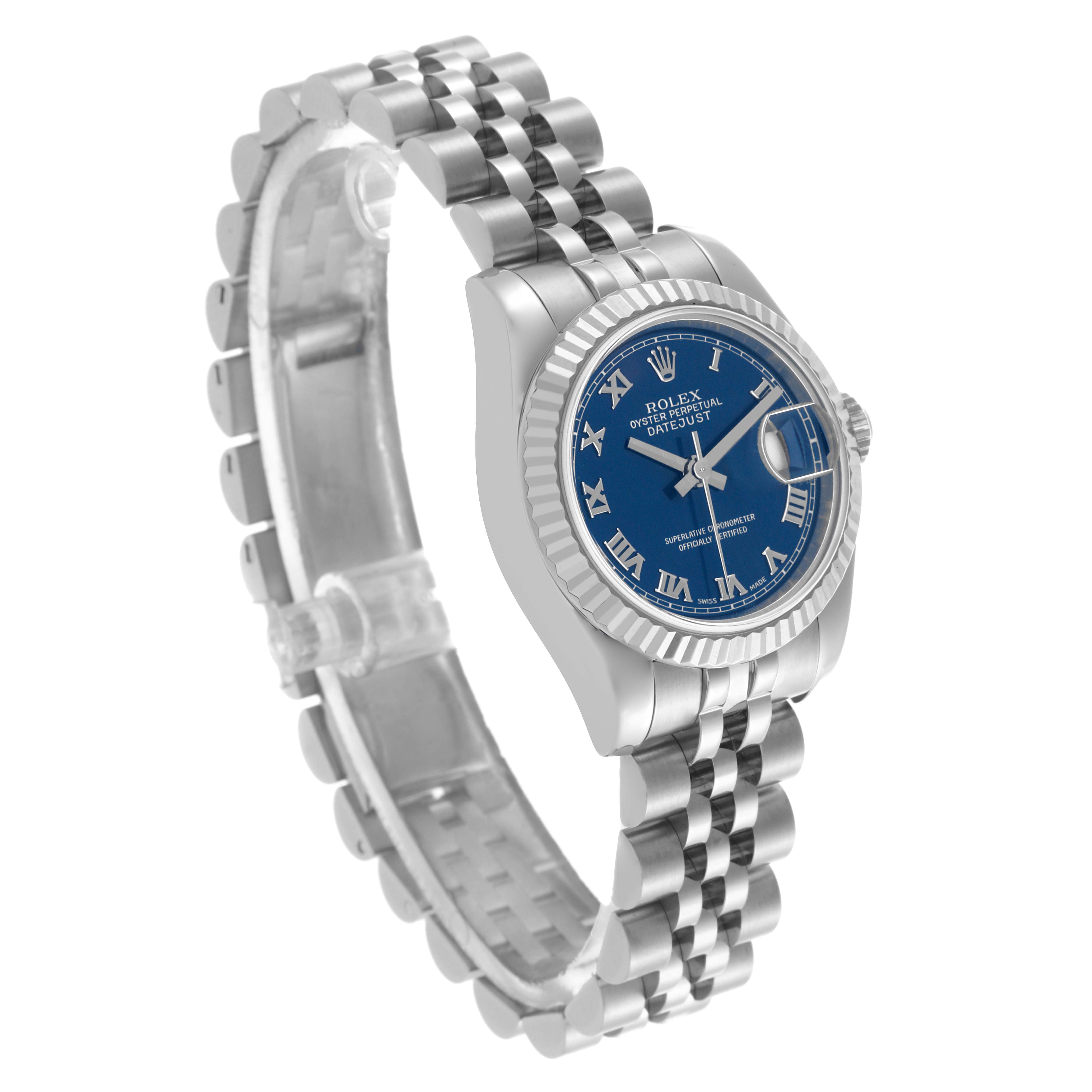 The Rolex Datejust 179174 Women's Stainless Steel Blue Dial 179174 Women's Stainless Steel Blue Dial watch is shown at a three-quarter angle, highlighting its blue dial, fluted bezel, and jubilee bracelet.