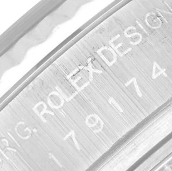 The image shows a close-up of the inner bezel engraving on a Rolex Datejust 179174 Women's Stainless Steel Blue Dial 179174 Women's Stainless Steel Blue Dial watch, highlighting model and design details.