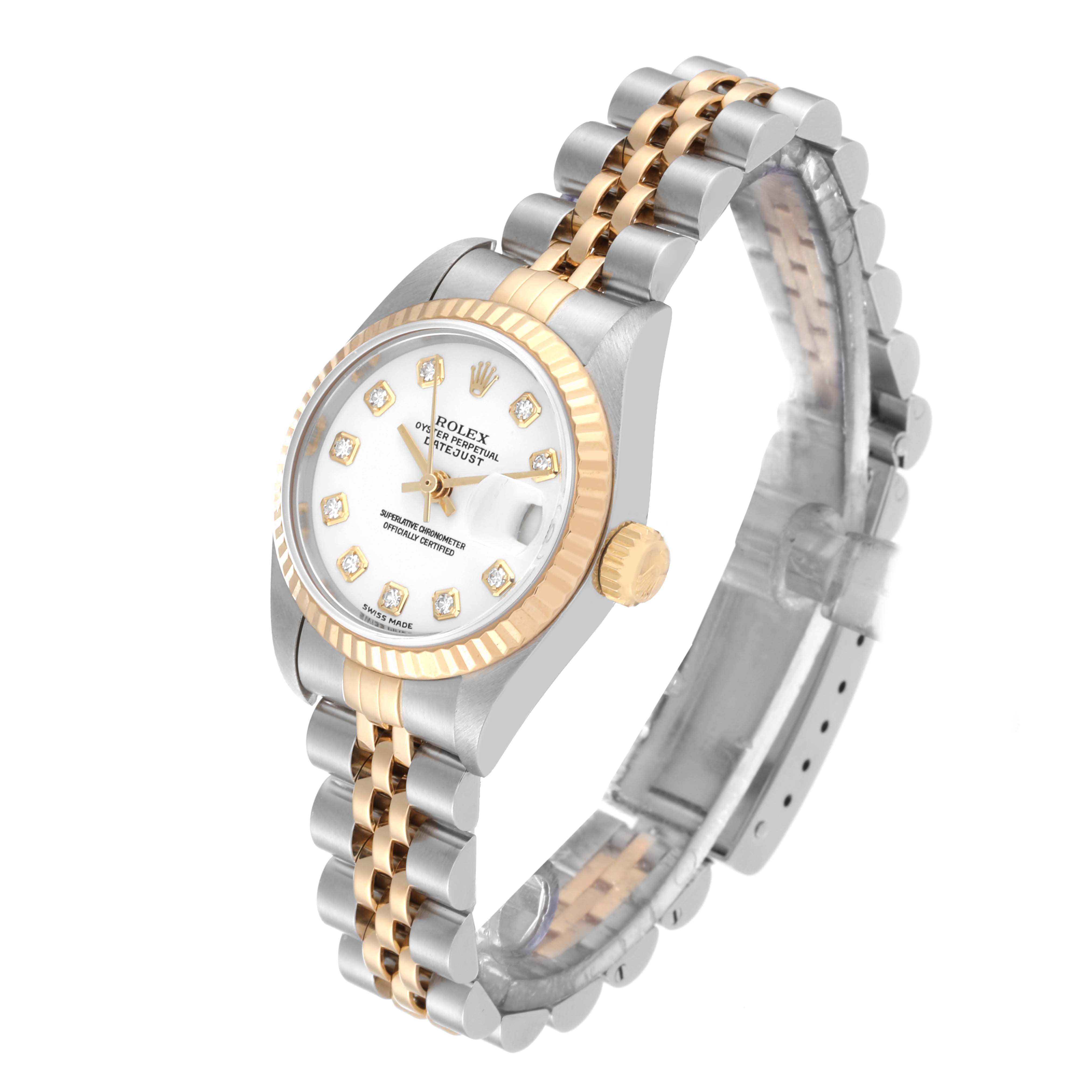 The image shows a Rolex Datejust 79173 Women's Steel and Gold (two tone) White Dial 79173 Women's Steel and Gold (two tone) White Dial watch at a tilted angle, highlighting its two-tone bracelet, fluted bezel, and diamond hour markers.