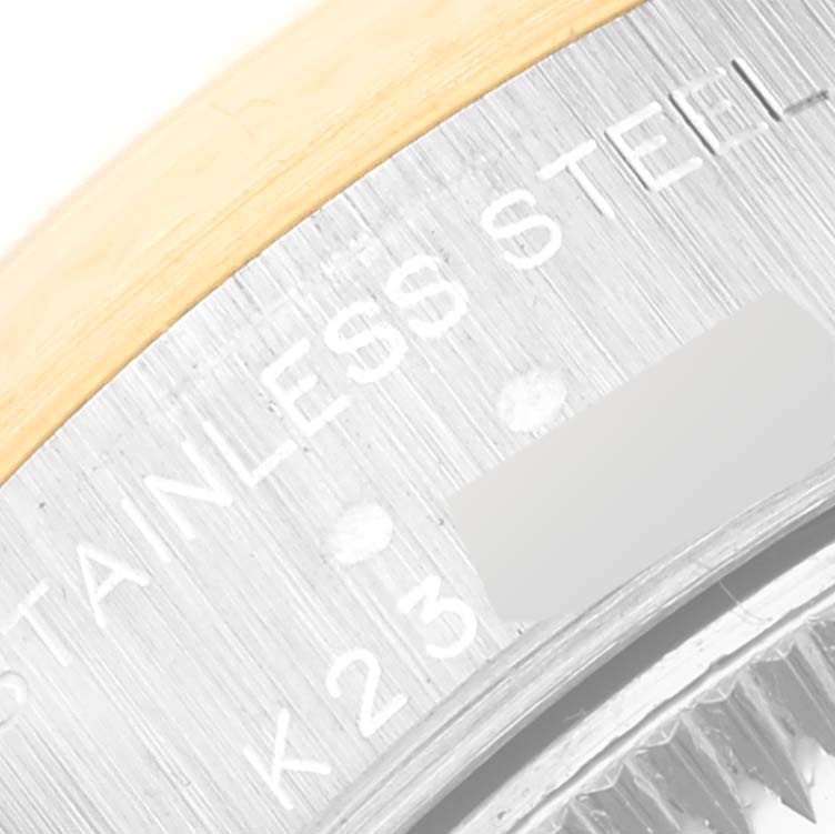 This close-up image shows the "STAINLESS STEEL" engraving on the case back of a Rolex Datejust 79173 Women's Steel and Gold (two tone) White Dial 79173 Women's Steel and Gold (two tone) White Dial watch.