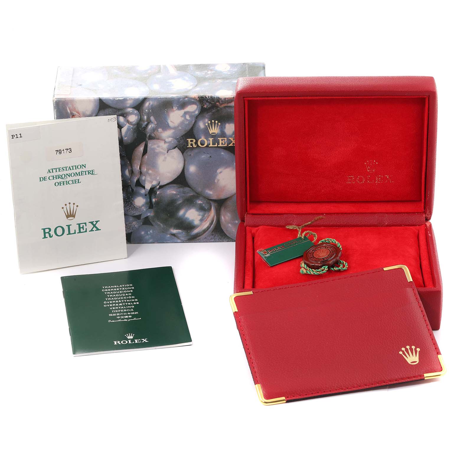 The image shows the box and accessories for a Rolex Datejust 79173 Women's Steel and Gold (two tone) Blue Dial 79173 Women's Steel and Gold (two tone) Blue Dial, including the warranty card, booklets, and tags.
