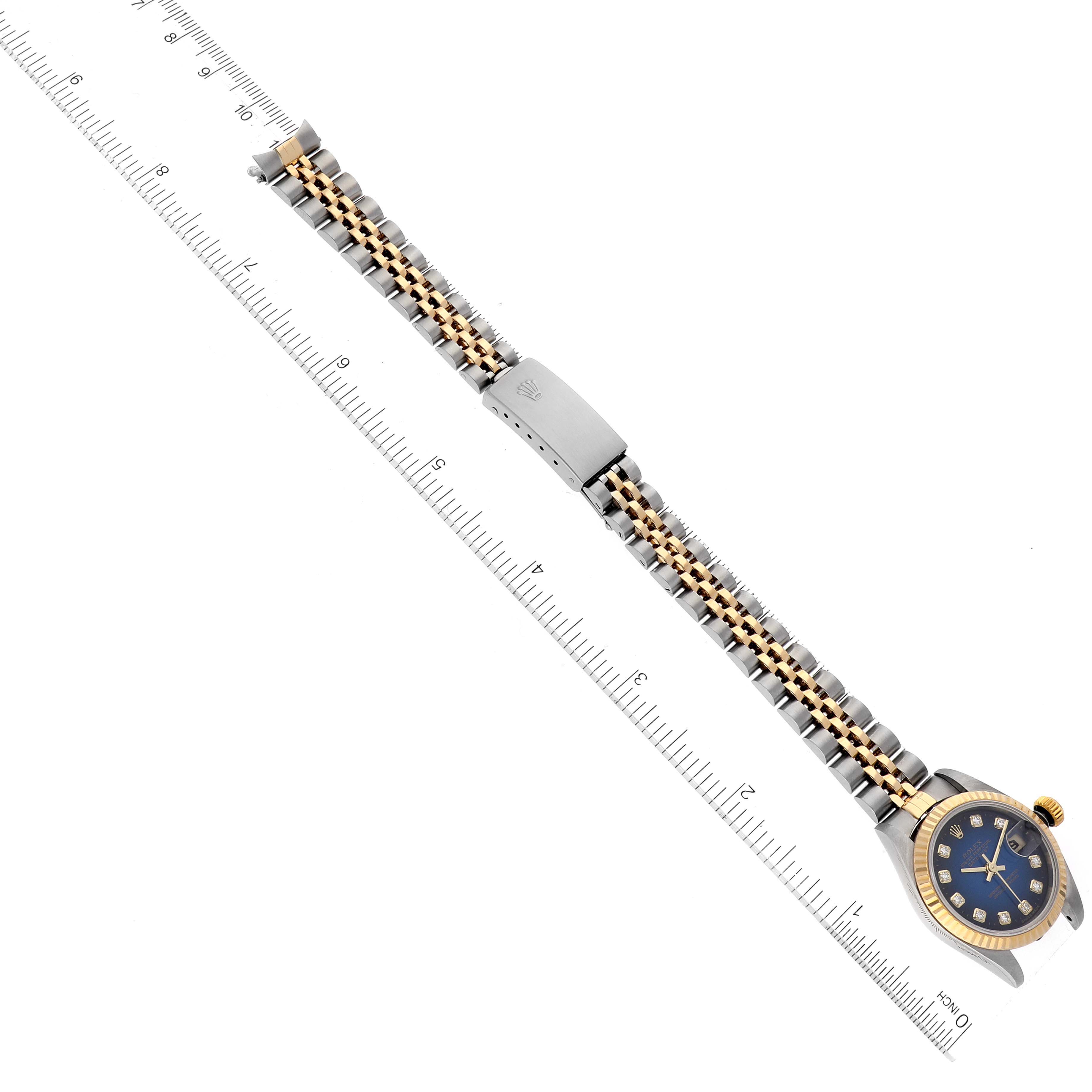 This image shows the Rolex Datejust 79173 Women's Steel and Gold (two tone) Blue Dial 79173 Women's Steel and Gold (two tone) Blue Dial watch from a top-down angle, highlighting its bracelet and clasp.