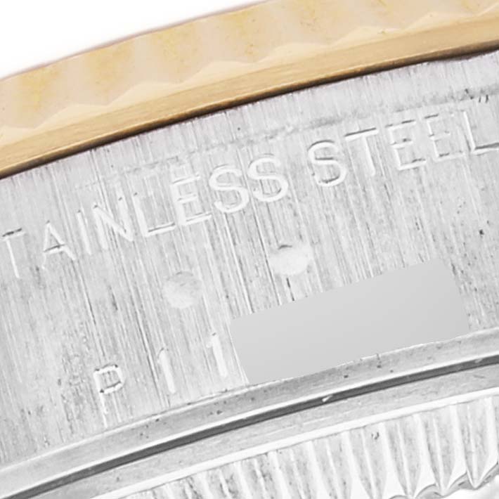 This close-up angle shows the stainless steel bezel and part of the serial number of the Rolex Datejust 79173 Women's Steel and Gold (two tone) Blue Dial 79173 Women's Steel and Gold (two tone) Blue Dial watch.
