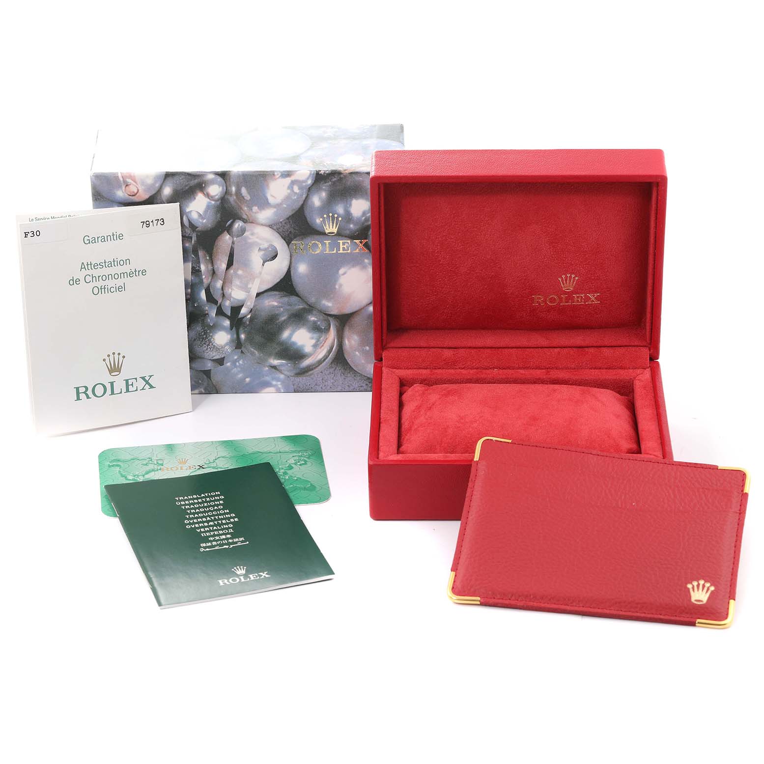 The image shows the packaging and accessories for a Rolex Datejust 79173 Women's Steel and Gold (two tone) Champagne Dial 79173 Women's Steel and Gold (two tone) Champagne Dial, including the box, warranty card, manuals, and cardholder from a front angle.