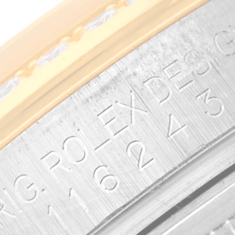 This close-up image shows the engraved inner bezel (rehaut) of a Rolex Datejust 116243 Men's Steel and Gold (two tone) White Dial 116243 Men's Steel and Gold (two tone) White Dial watch.